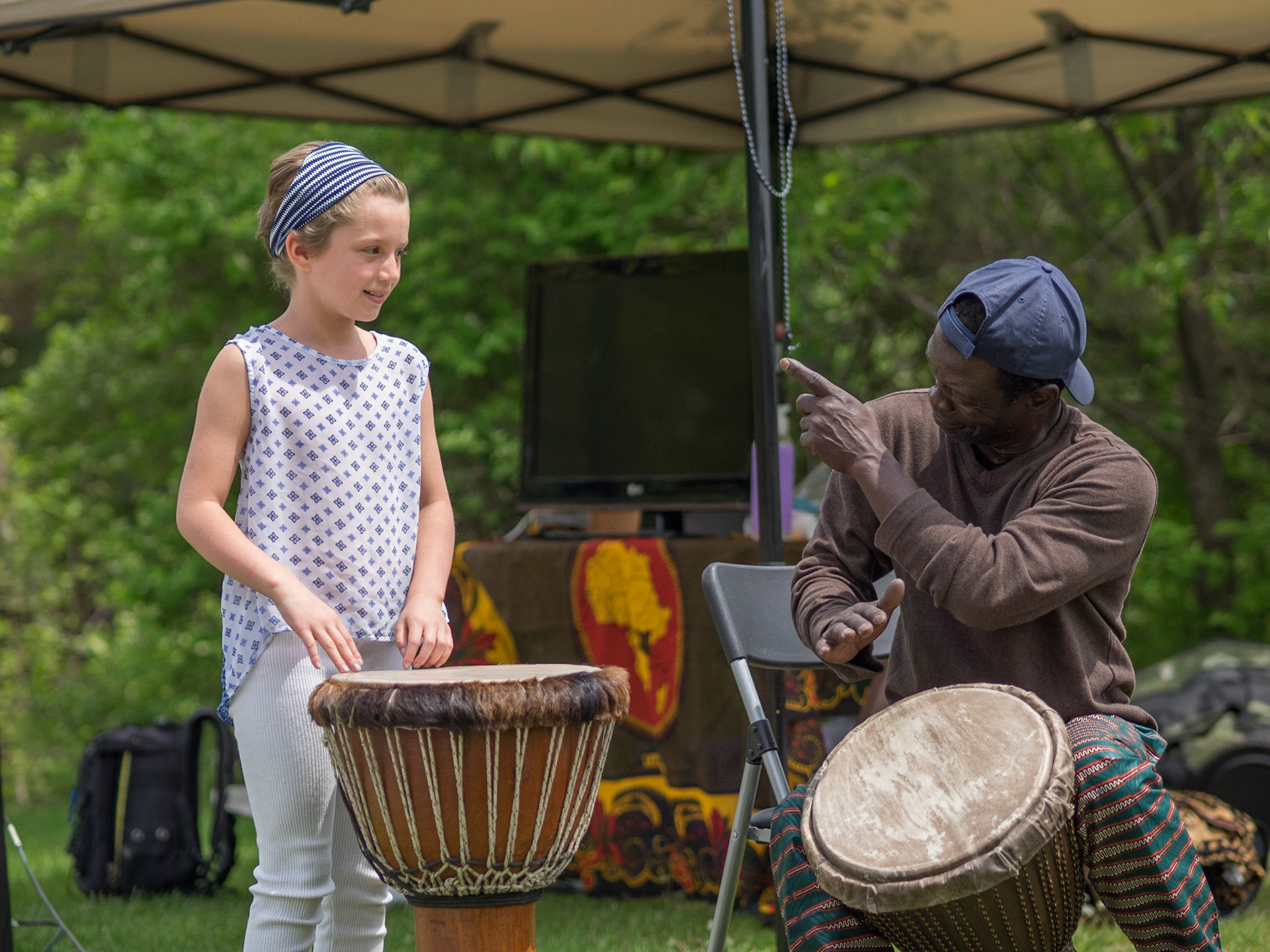 Abou teaching drumming