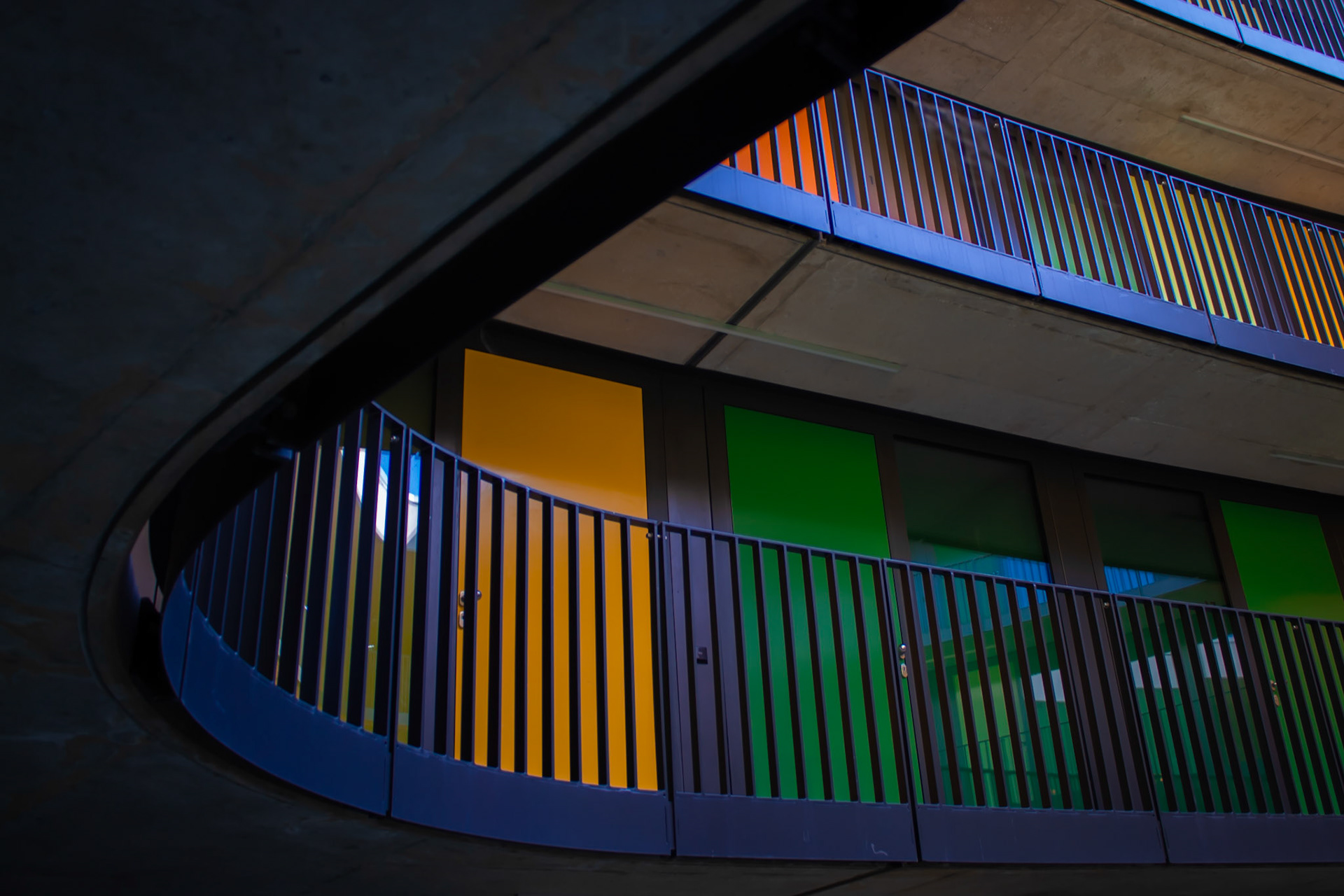 Looking up at colorful Doors on several Floors