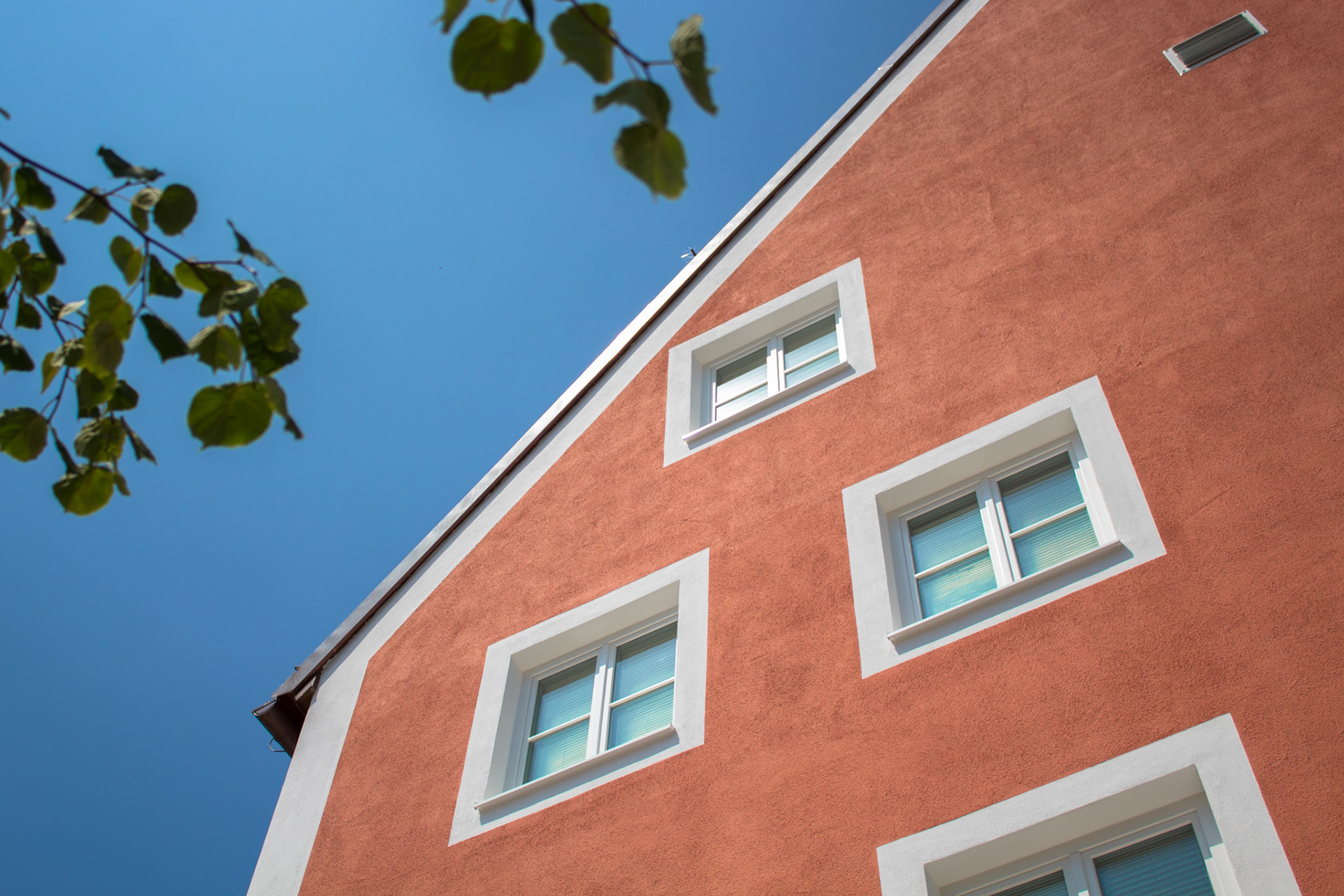 Red House in front of blue Sky