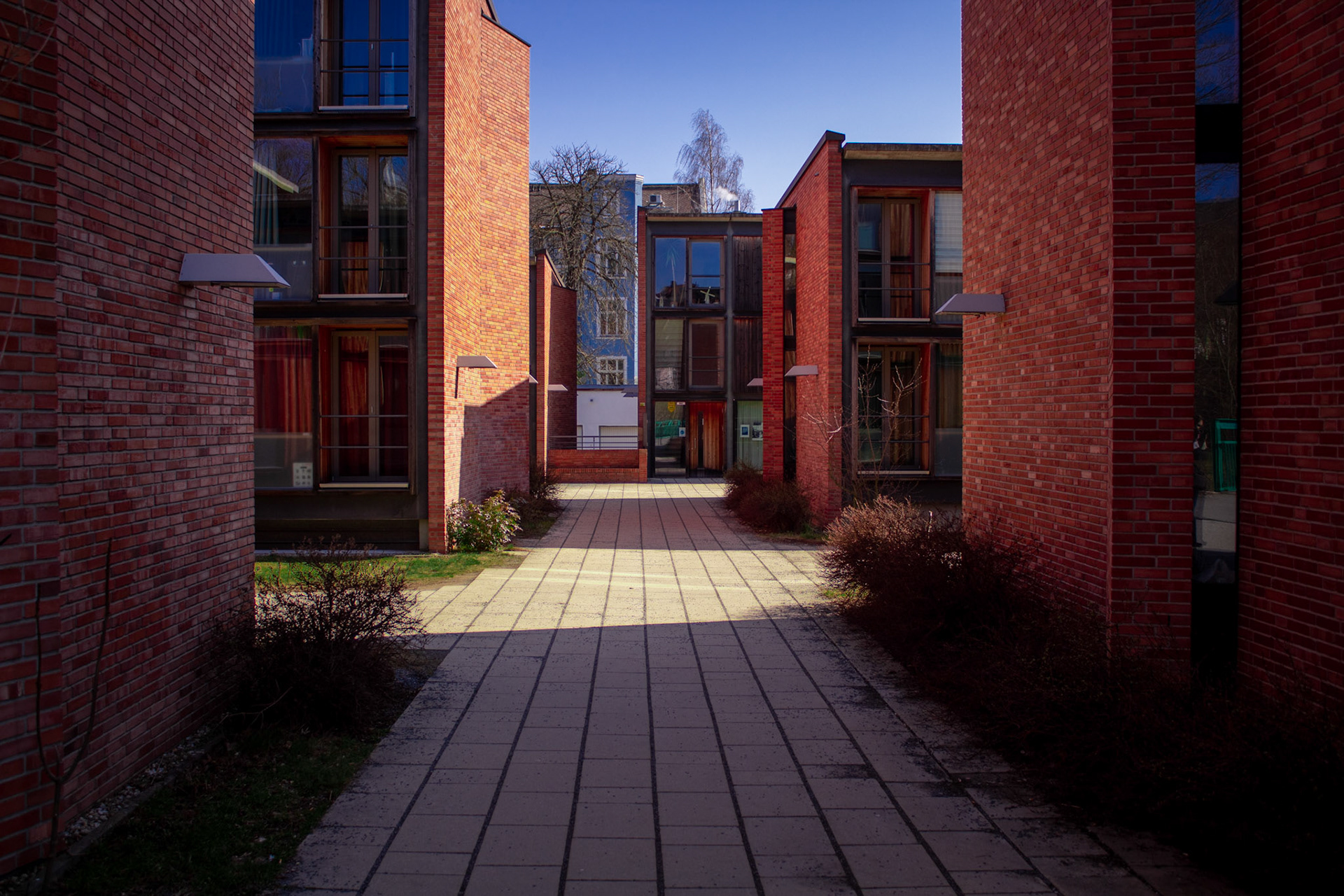 Sidewalk through Brick Buildings