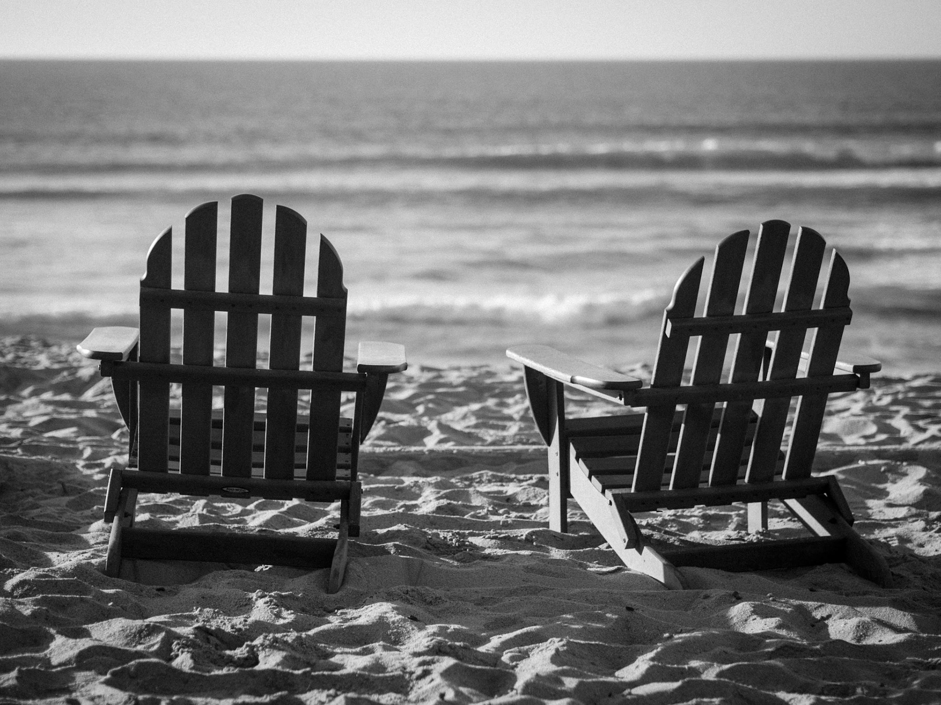 This photo of two lonesome deck chairs was taken at Sanctuary Beach close to Monterey, CA.