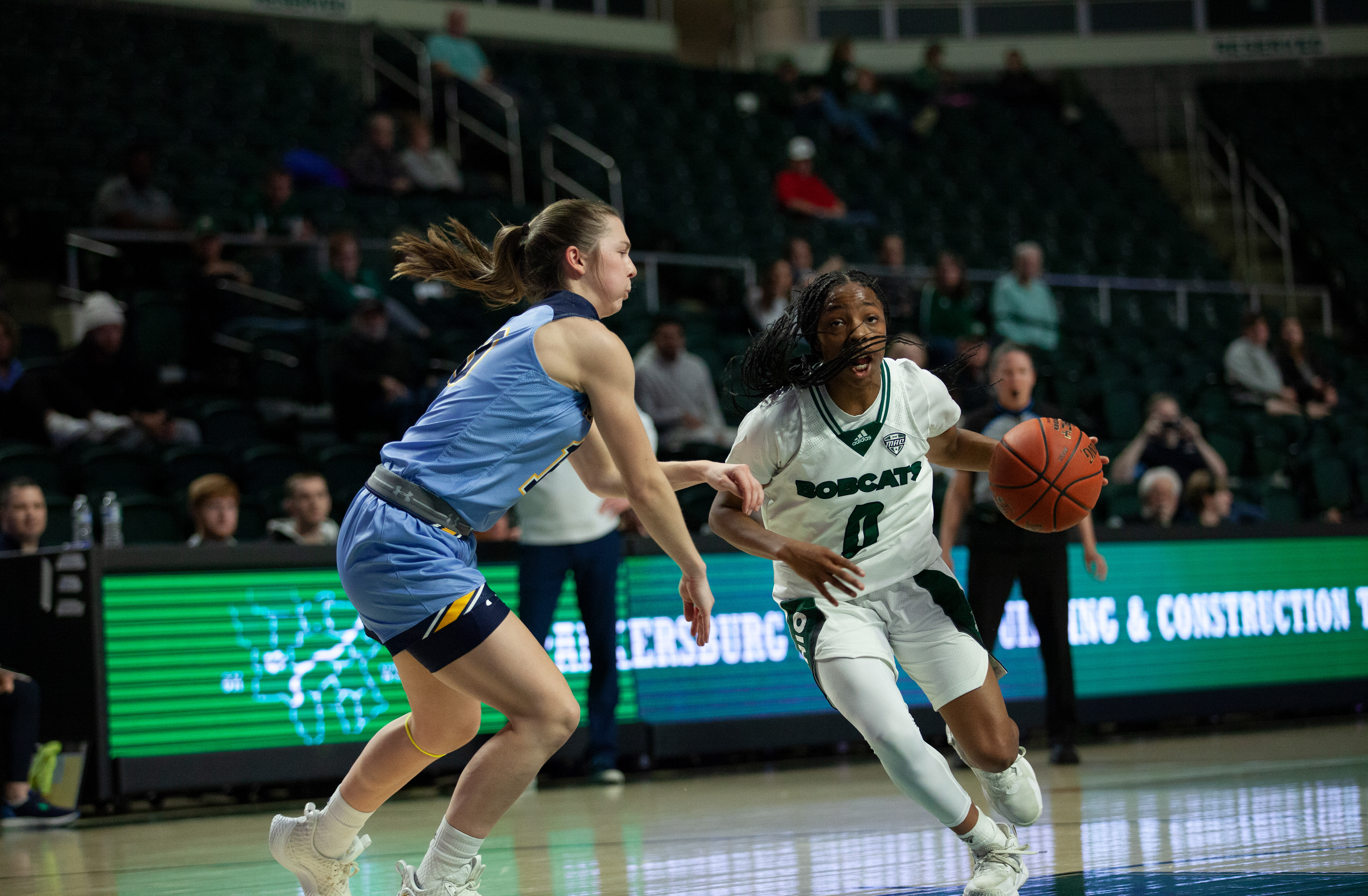 Ohio guard, Jaya McClure (0), dribbles the ball during a game against Kent State at The Convo, Feb. 21, 2024 in Athens, Ohio. The Bobcats won the game 79 to 77. 