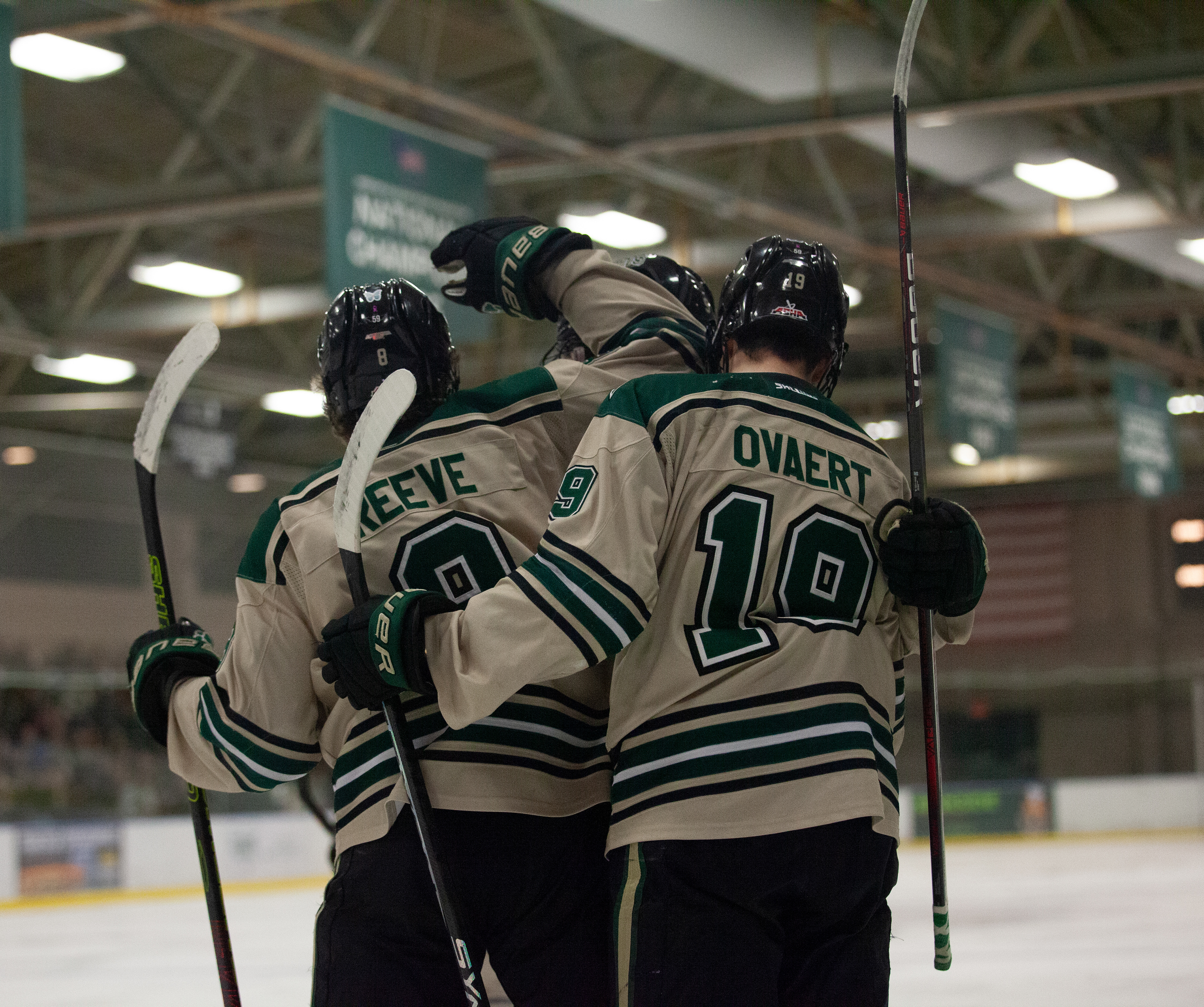 Ohio forwards, Luc Reeve (8) and Mathieu Ovaert (19), hug teammates to celebrate a goal during a game against Maryville University at Bird Ice Arena, Jan. 27, 2024 in Athens, Ohio.