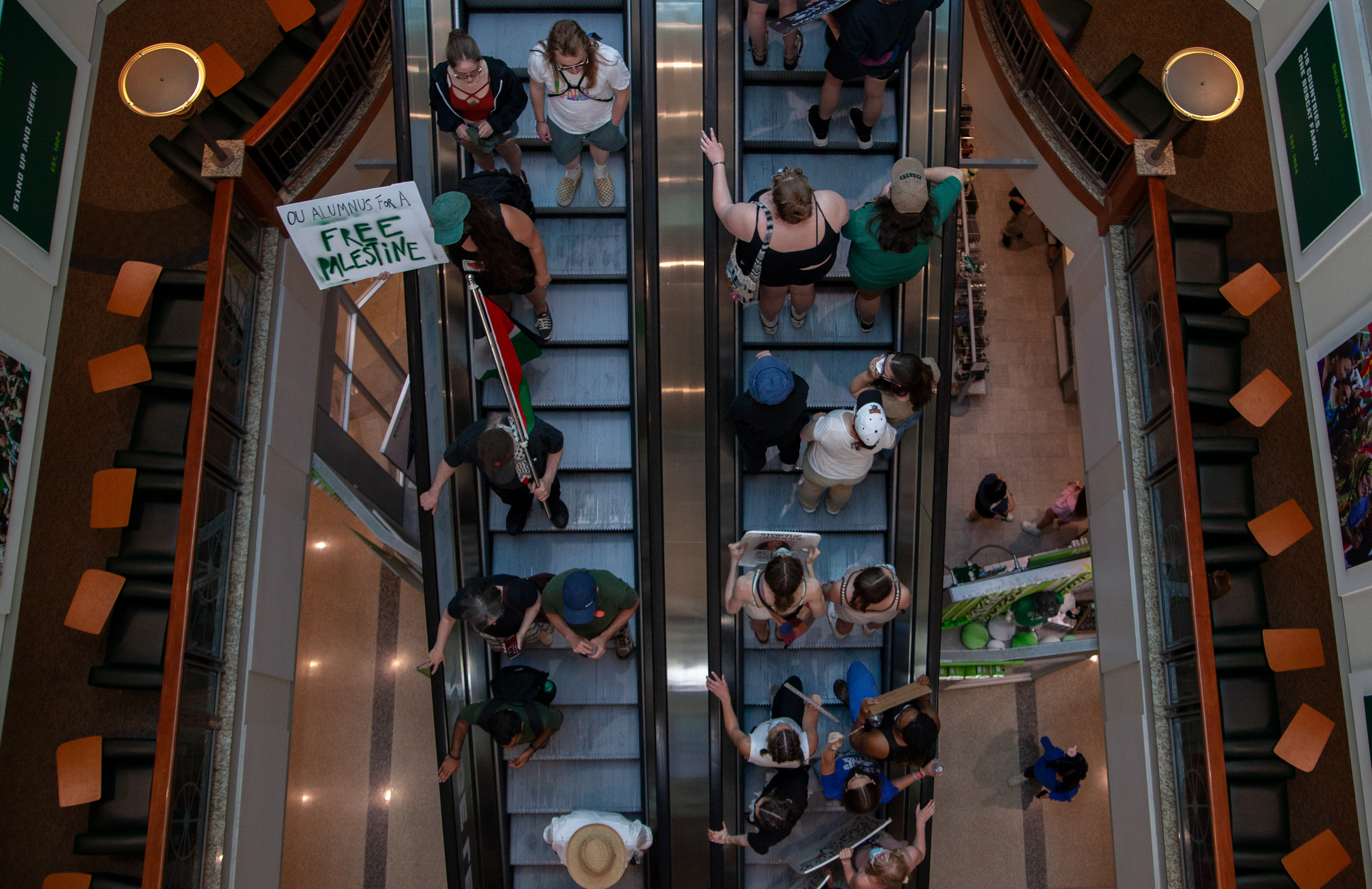 Protestors go up and down the escalators in Baker University Center at a protest for Gaza organized by Students for Justice in Palestine Ohio University, May 1, 2024, in Athens.