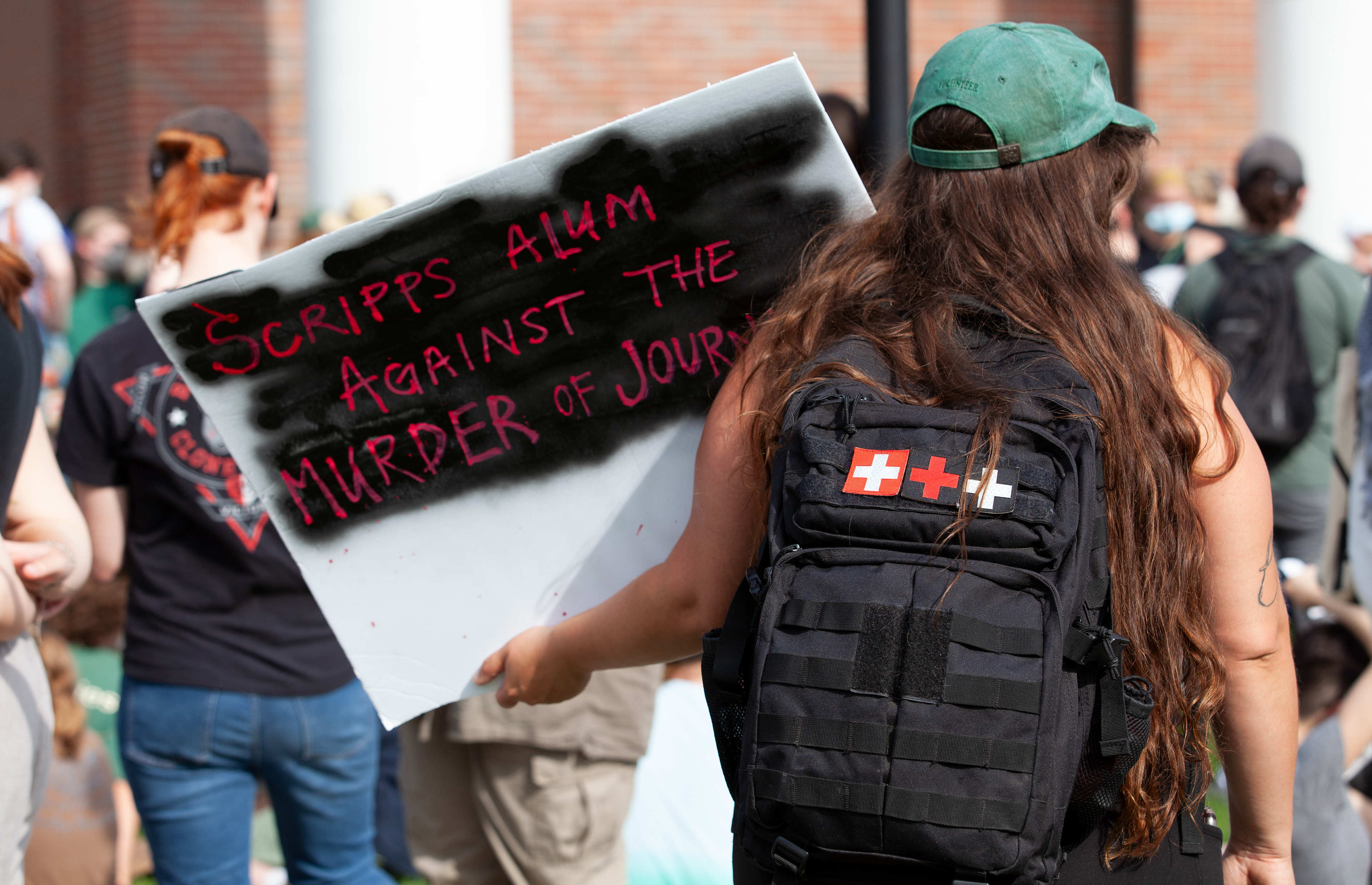 Alisha Bicknell holds a sign to protest outside Walter Hall at a protest for Gaza organized by Students for Justice in Palestine Ohio University, May 1, 2024, in Athens.
