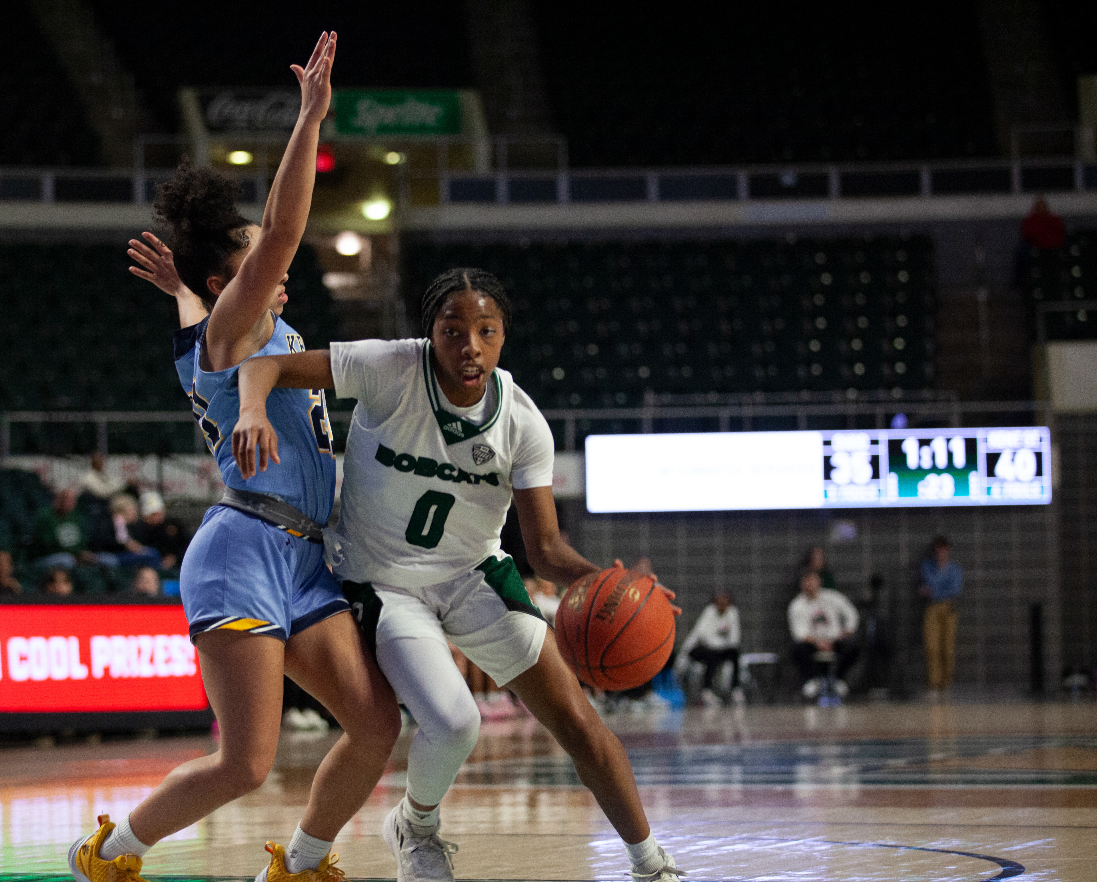 Ohio guard, Jaya McClure (0), dribbles the ball during a game against Kent State at The Convo, Feb. 21, 2024 in Athens, Ohio. The Bobcats won the game 79 to 77. 