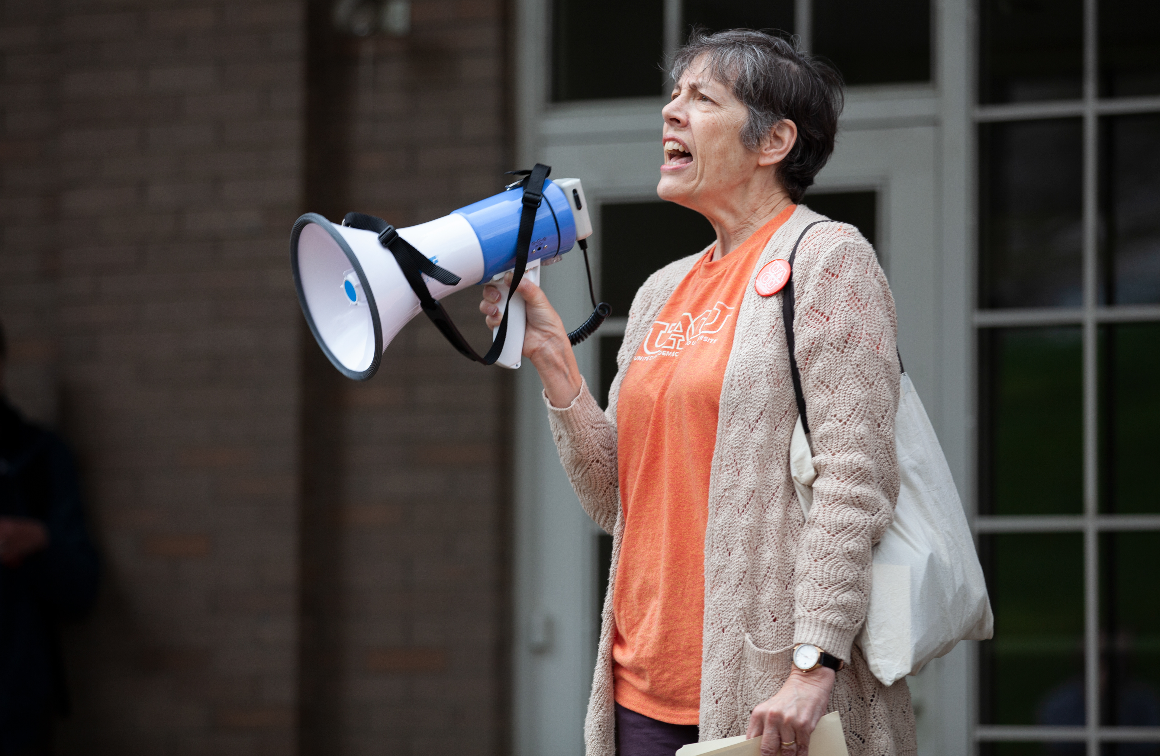 Katherine Jellison, a history professor at Ohio University, speaks to the crowd at an event updating the public on the unionization organized by United Academics of Ohio University at Scripps Ampitheater, April 10, 2024, in Athens. 