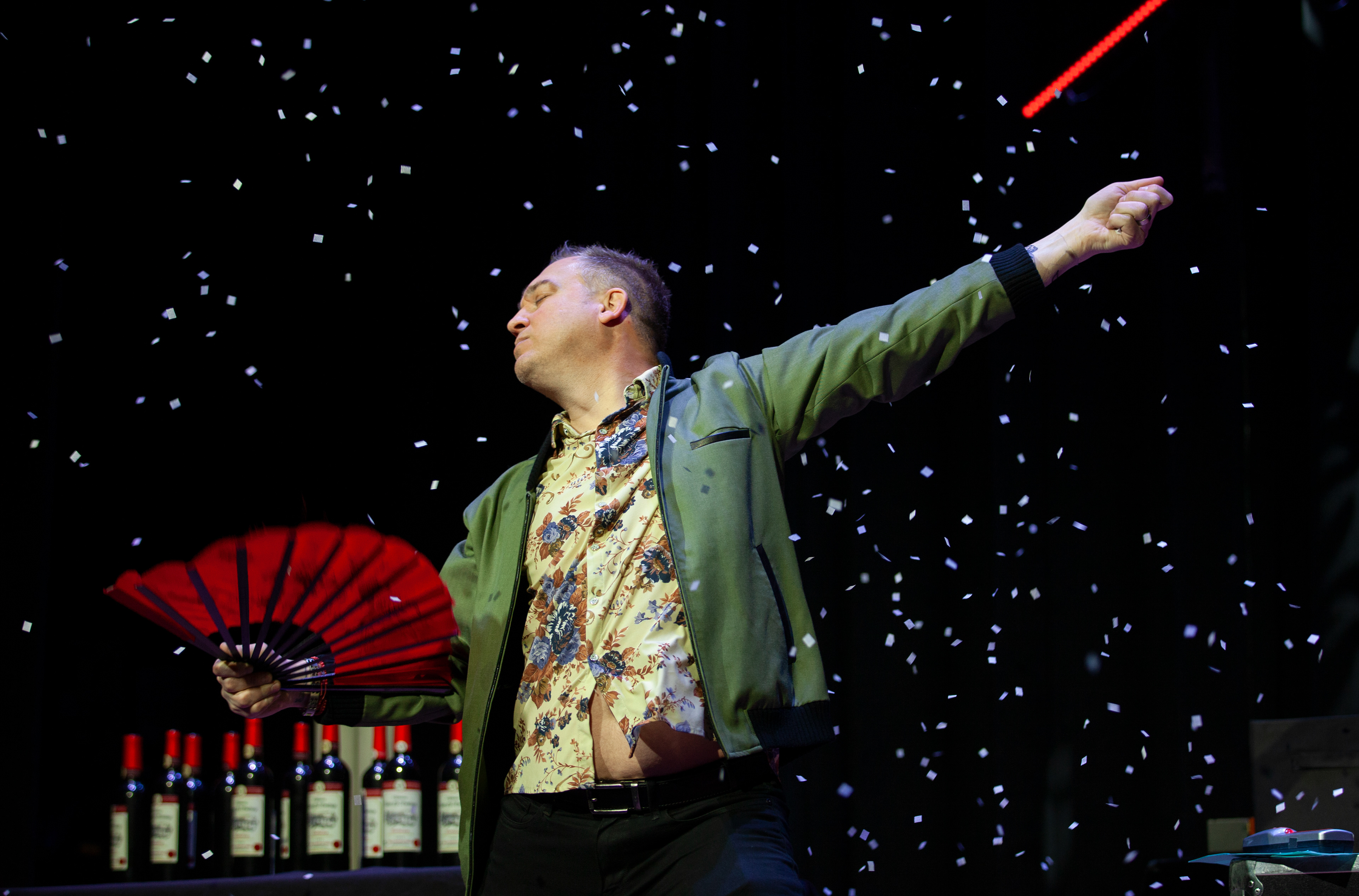 Michael Kent, an American comedian and magician, strikes a pose with a fan as confetti falls during his show at Baker Theater, Feb. 3, 2024 in Athens, Ohio. Kent put on his performance as part of Ohio University's annual Sibs Weekend.