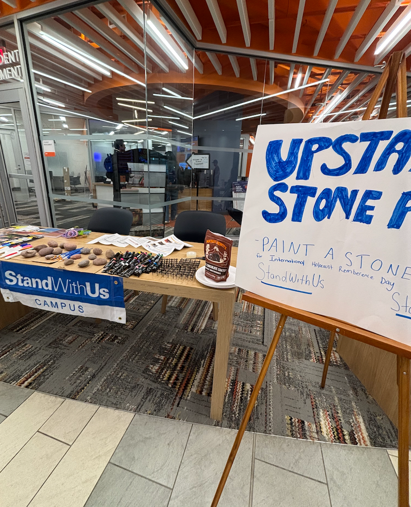 Set up for Upstander Stone tabling in Schine Student Center