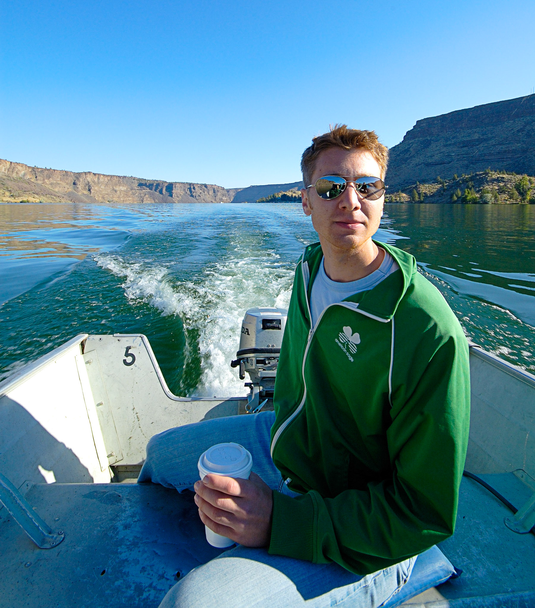 Travis pointing the boat toward the fish on Lake BillyChinook, Oregon.