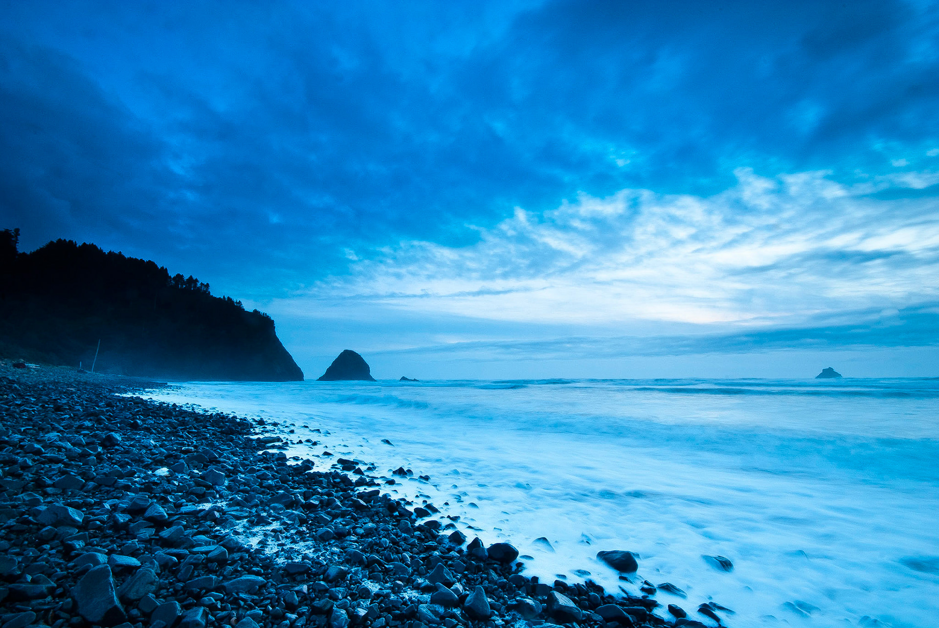 Nicole and I took a weekend vacation to Arch Cape, Oregon last weekend. This shot was taken a little over a day after the tsunami wave hit the Oregon coast. There wasn't much evidence of the tsunami, other than a few chunks of driftwoof further up the beach than normal and the tide seeminly high the entire time we were there.