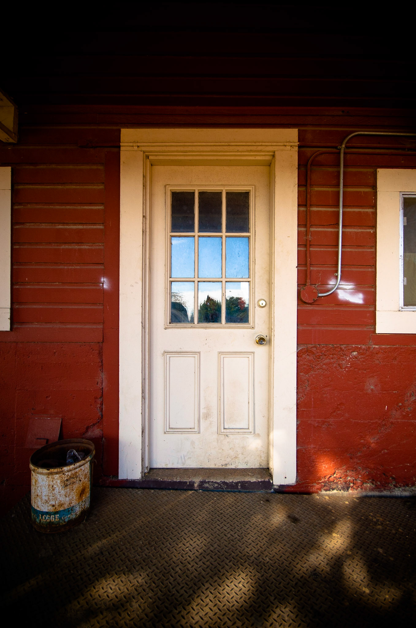 A white door on a red barn. Classic. Shot at the Pumpkin Patch at Sauvie Island, near Portland.