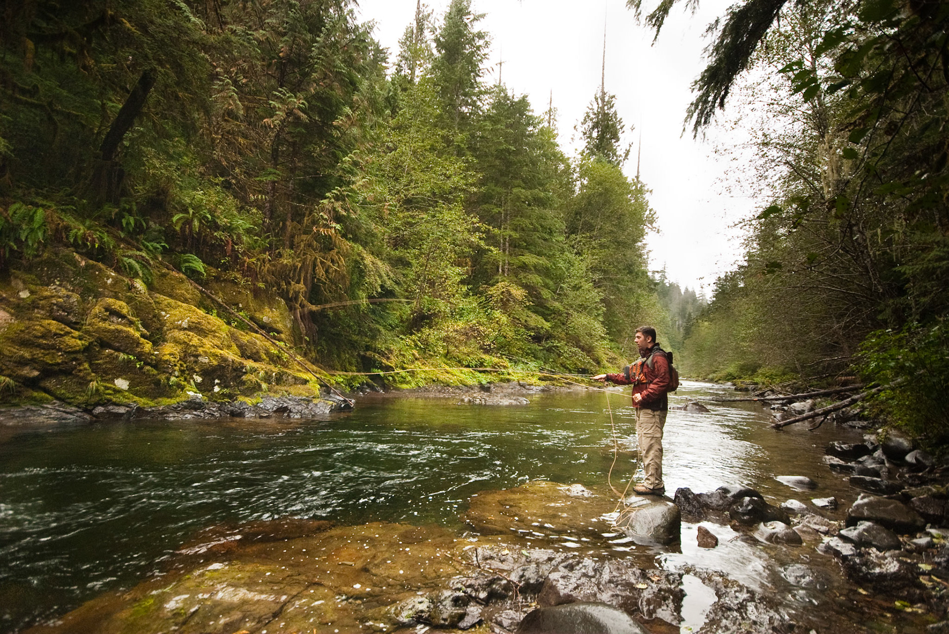 Bryan casting into the crystal-clear water. My role, apart from taking photos, was scouting the fish from a rock high above the surface.