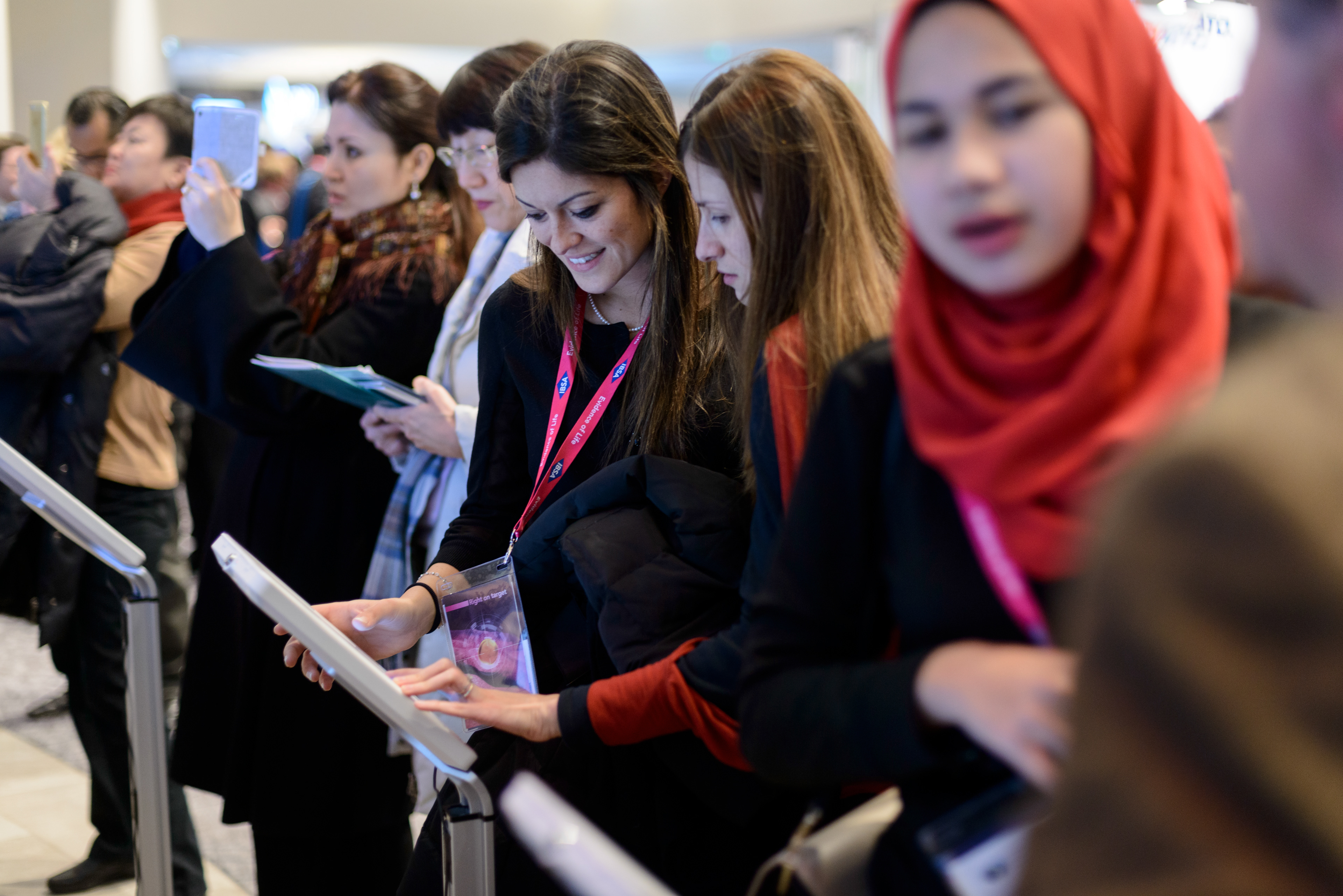 Participants consult E-posters that can be navigated by a tablet or a smartphone application at the 20th World Congress on Controversies in Obstetrics, Gynecology & Infertility (COGI). Paris, France.