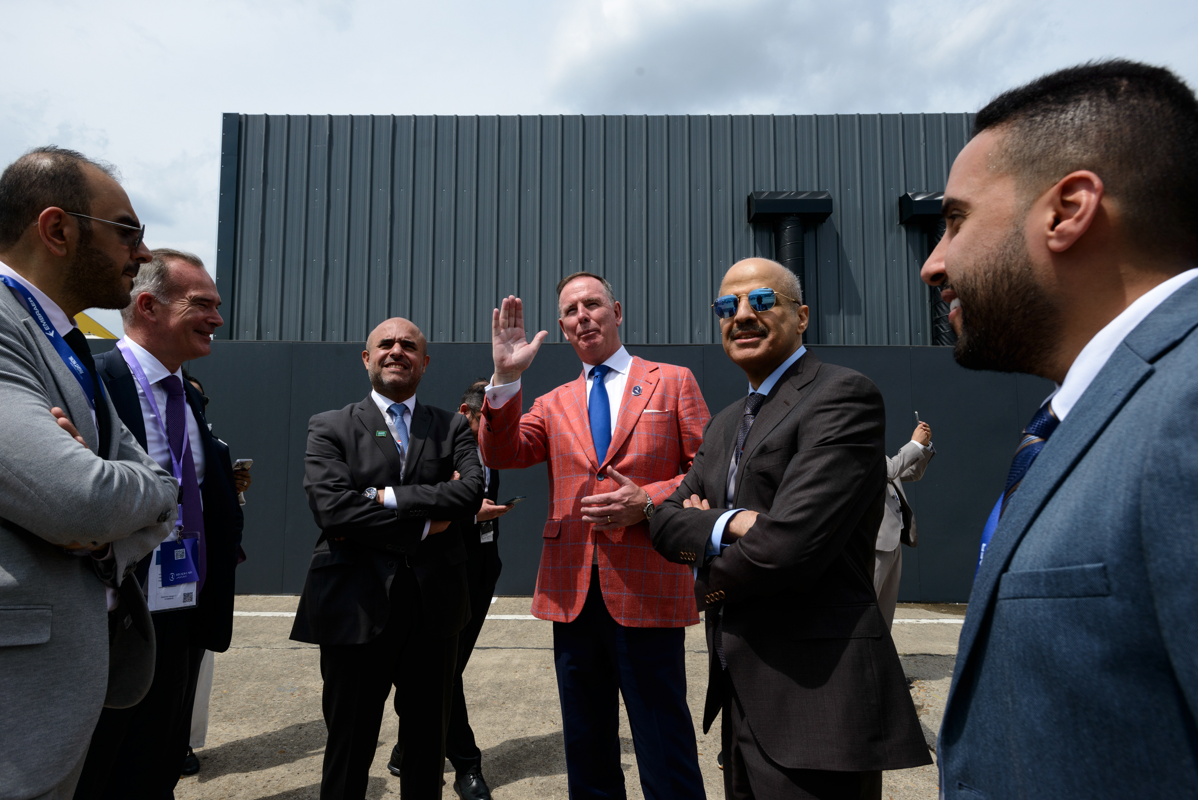 Eng. Mohammed Al-Maghlouth (center right) and Musad Abdulaziz Al-Daood (center left), the CEOs of the Riyadh Aiirports Company, listen to Tony Douglas (center), British business man and CEO of Riyadh Air, describing the airline's first Boeing 787-9 Dreamliner that is making its public debut at the 54th Paris Air show. The delegation is in Paris to promote the Saudi plan for a six-runway mega airport in Riyadh and the the new Saudi Arabian flag carrier Riyadh Air, scheduled to launch in early 2025, part of Saudi Arabia's Vision 2030 Investment plan to diversify its economy away from oil. Le Bourget, France.