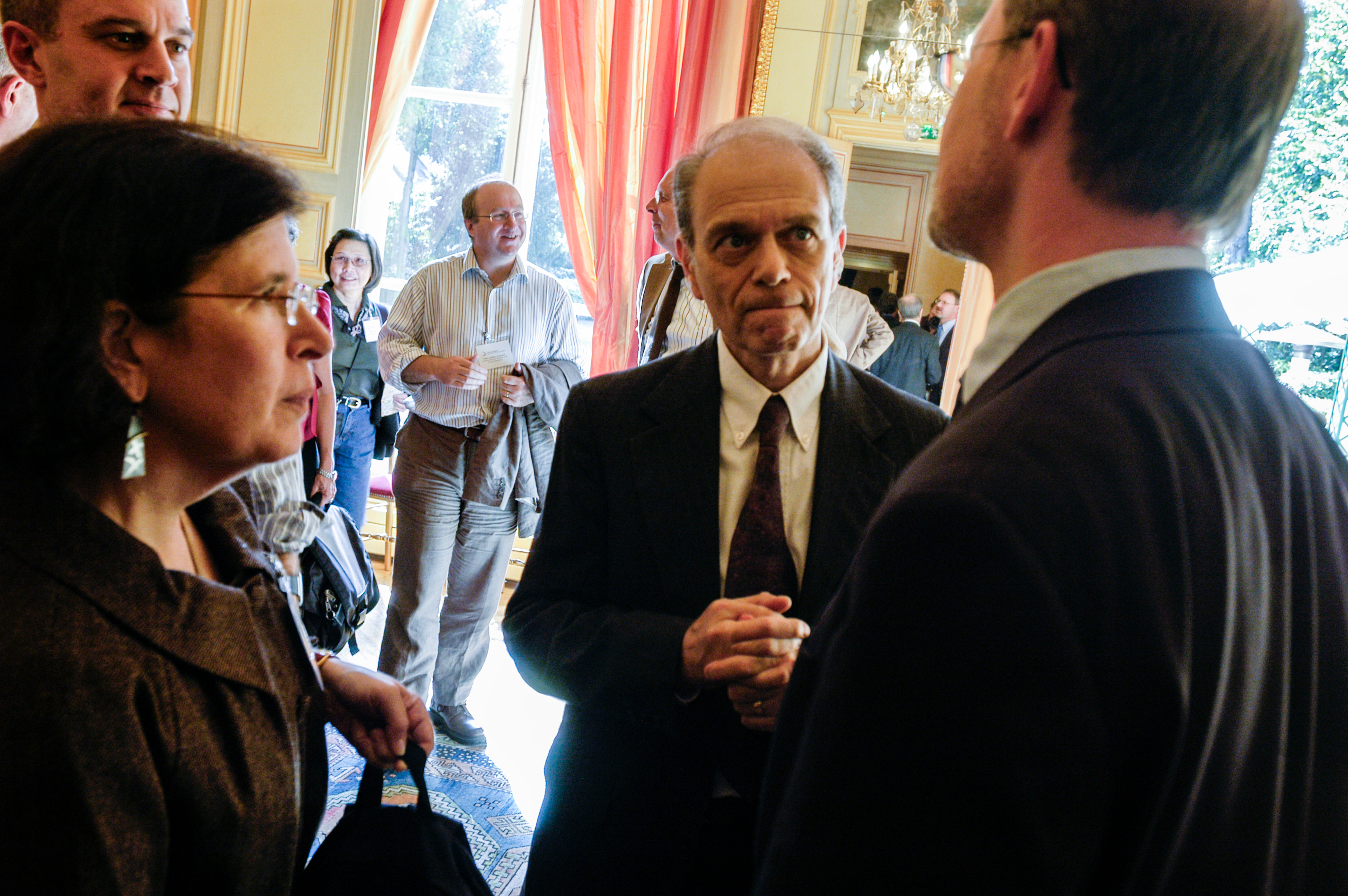 Mel Spigelman, TB Alliance Director of Research and Development, talking with Ann Ginsberg, Head of Clinical Development, and William Wells, Senior Communications Officer, at the stakeholders association annual meeting at the Maison de l'Amerique Latine. Paris, France.