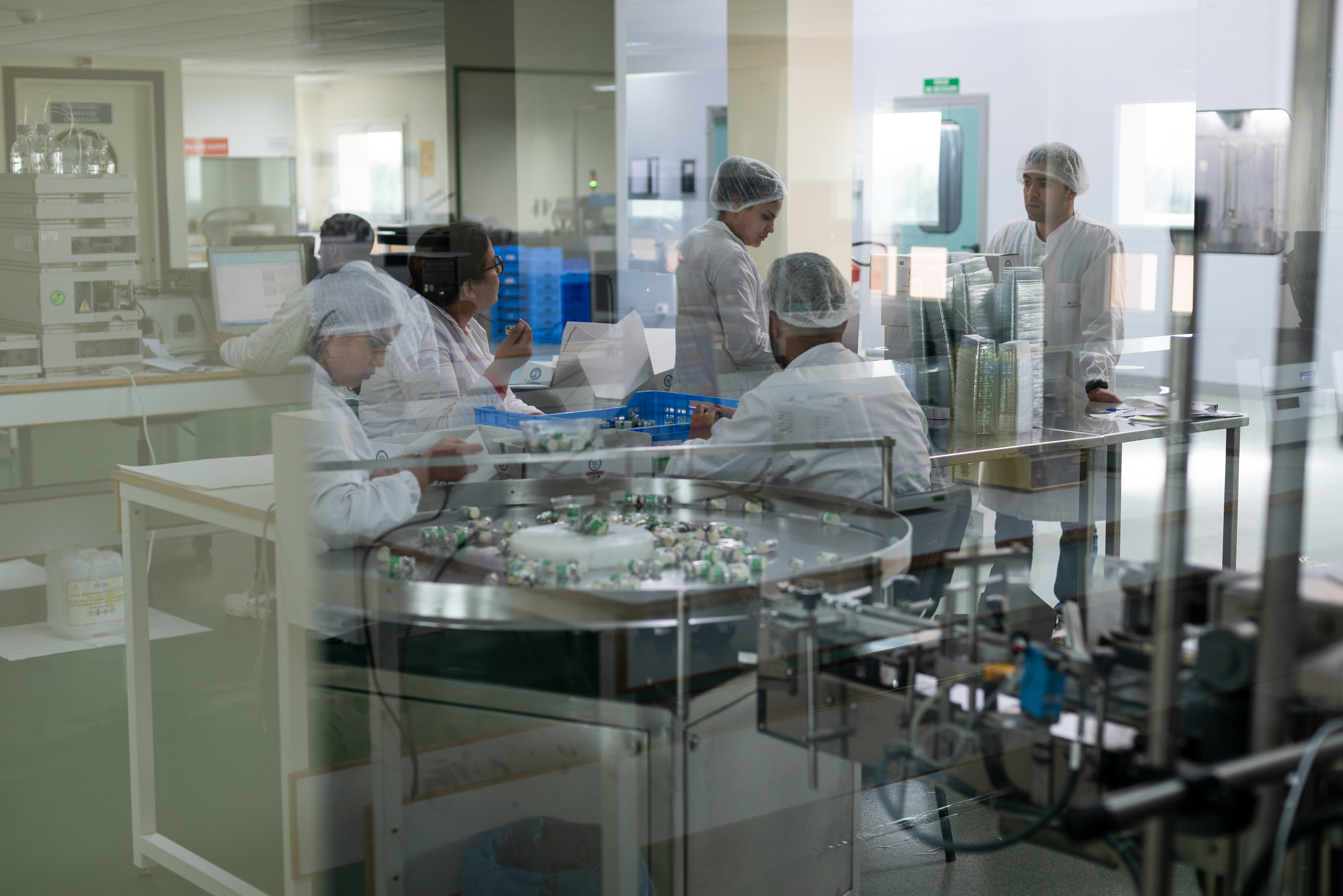 Technicians preparing final products in the in the conditioning and packaging unit of the MCI Santé Animale laboratory.