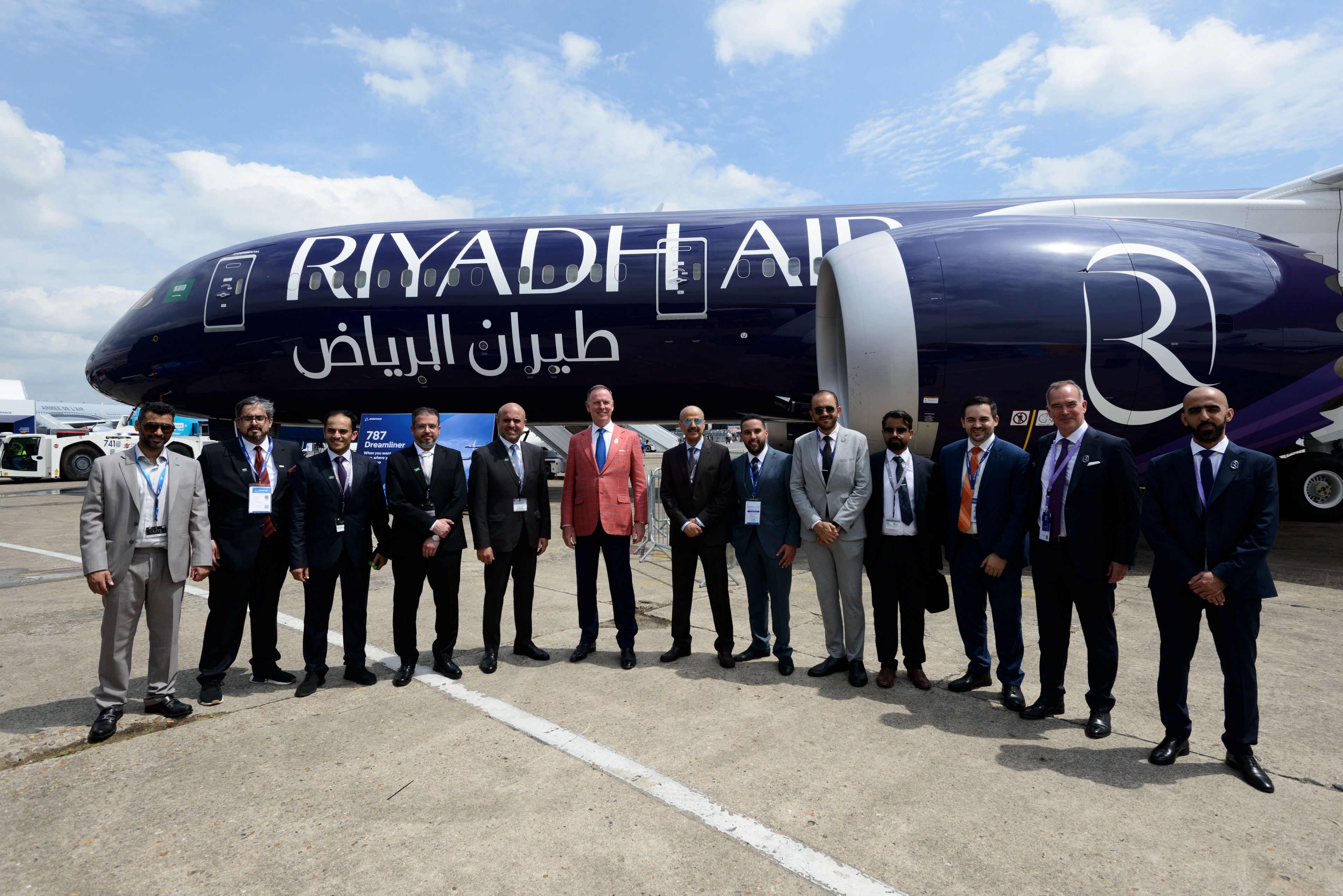 Eng. Mohammed Al-Maghlouth (center right) and Musad Abdulaziz Al-Daood (center left), the CEOs of the Riyadh Aiirports Company, pose for a photo with Tony Douglas (center), British business man and CEO of Riyadh Air, and the Saudi delegation in front of the airline's first Boeing 787-9 Dreamliner that is making its public debut at the 54th Paris Air show. The delegation is in Paris to promote the Saudi plan for a six-runway mega airport in Riyadh and the the new Saudi Arabian flag carrier Riyadh Air, scheduled to launch in early 2025, part of Saudi Arabia's Vision 2030 Investment plan to diversify its economy away from oil. Le Bourget, France.