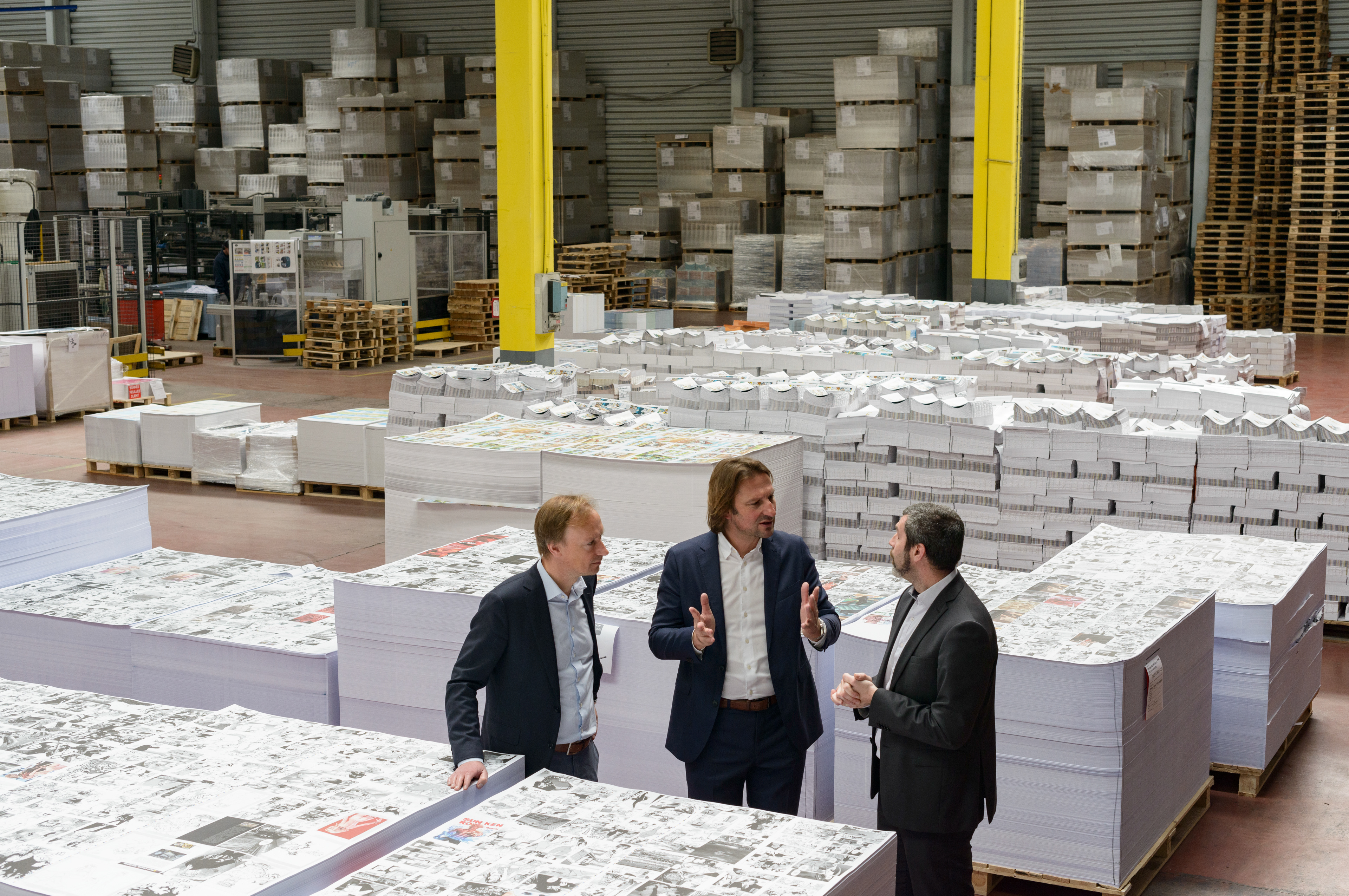 Denis Geers (center), CEO of the Graphius Group, a leading printing group founded in Ghent, Belgium in 1928, discusses operations with Philippe Geers (left), CFO of the Graphius Group, and Stéphane Robert (right), General Director of PPO Graphic outside of Paris. Part of the Graphius Group, PPO Graphic specializes in the printing of comics and illstrated books. Palaiseau, France.