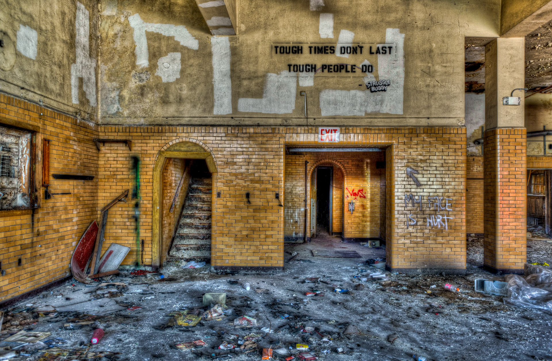 Shot for Week 42 of my "52 of Twenty Eleven" flickr group given the theme "Words".<a href="http://www.flickr.com/photos/30114141@N02">Patty</a>, one of my camera club friends knew I was looking for "words" today, and she was kind enough to show me this spot.  The words "Tough Times Don't Last, Tough People Do" are poignant on the wall of this abandoned firestation in Highland Park  (a city in the metropolitan Detroit area).   Detroit continues to struggle through very tough times and places like this, where tough and brave men once worked and lived to protect the people of the city, are now abandoned and utterly destroyed.I hope the person that wrote these words is right, because it would mean there is hope for better times for our city.  Press "L" to check it out on black.  It's worth it...