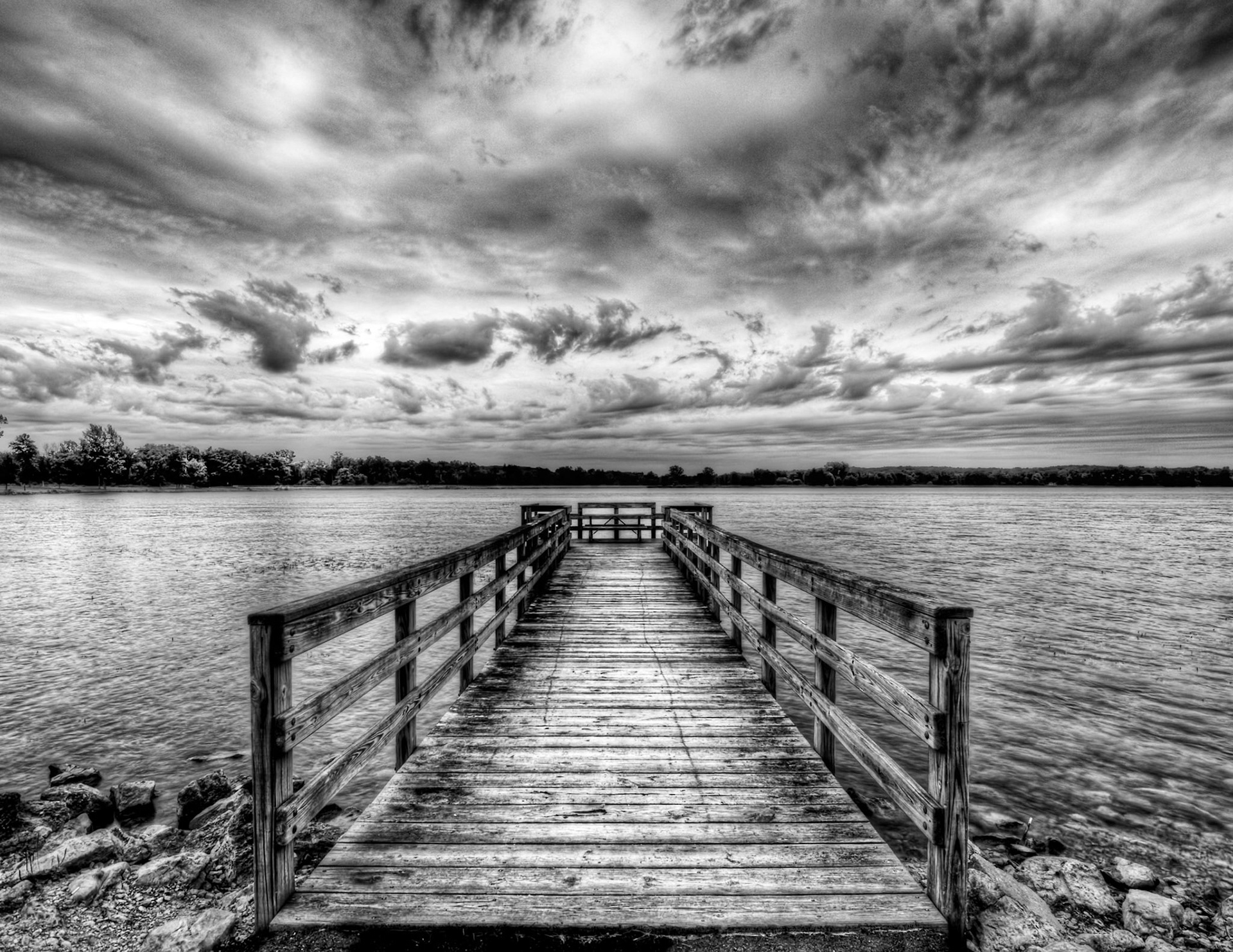 Shot for Week 28 of my "52 of Twenty Eleven" flickr group given the theme of "Black and White".I went to shoot at this park by our house yesterday because the sky looked like it was going to be perfect for sunset. Big puffy white clouds building along the horizon.  When I got there, the sky had become very gray, and the colors for a beautiful sunset just never developed.  Sooooooo, it was a perfect chance to put together a black and white shot for this week's theme.  This dock seemed to be reaching out into the lake, offering someone a perfectly peaceful place to ponder a day's challenges or an evening's opportunities. I hope you like it.  You could probably have guessed that I'd be suggesting that you check this out on black.  So go ahead, press the "L" key on your keyboard.  I think you'll be glad you did...