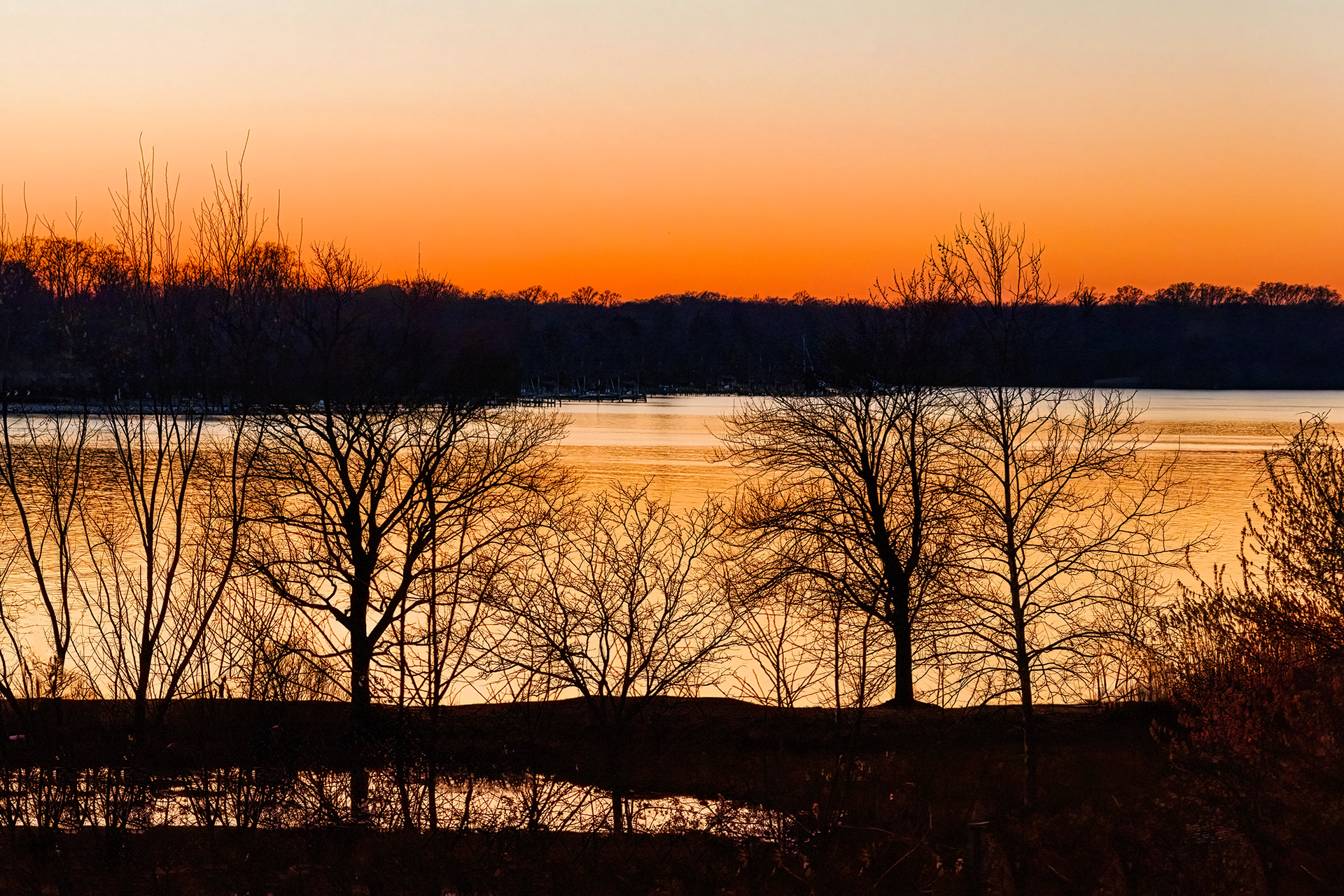 The Severn River near the Naval Academy glows during a golden sunset.