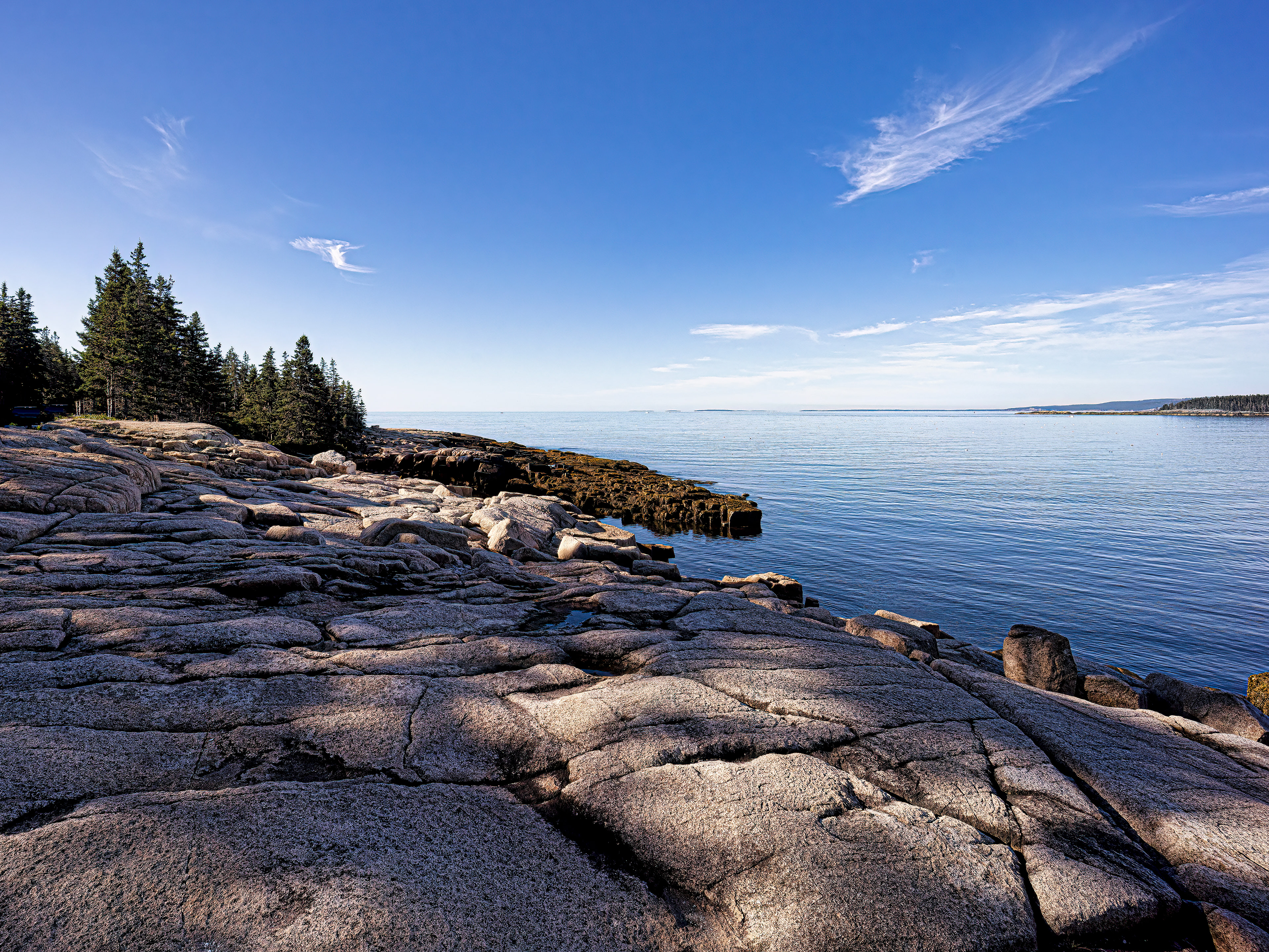 View of Frazer Point in Acadia National Park, Maine, captured in the crisp, cool air of early morning, highlighting the coastal landscape.