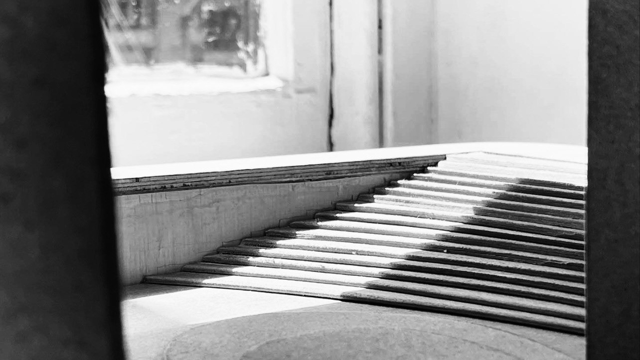 GROUND LEVEL STAIRCASE PROVIDING ACCESS TO EXTERIOR PERFORMANCE SPACE