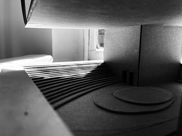 GROUND LEVEL STAIRCASE PROVIDING ACCESS TO EXTERIOR PERFORMANCE SPACE