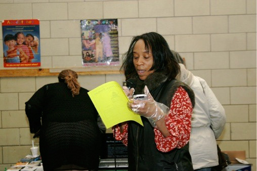 Ms. Rina Risper, writer, poet, & newspaper publisher reading her poetry  to Shabazz Academy students
