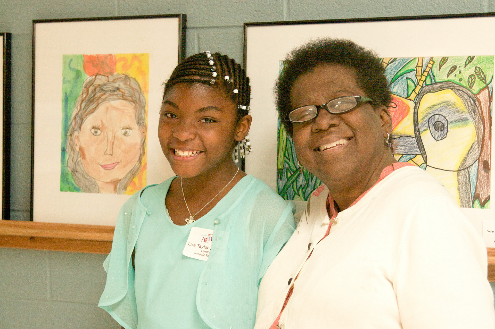 Mama Jackie with her first place winning Shabazz Academy art student