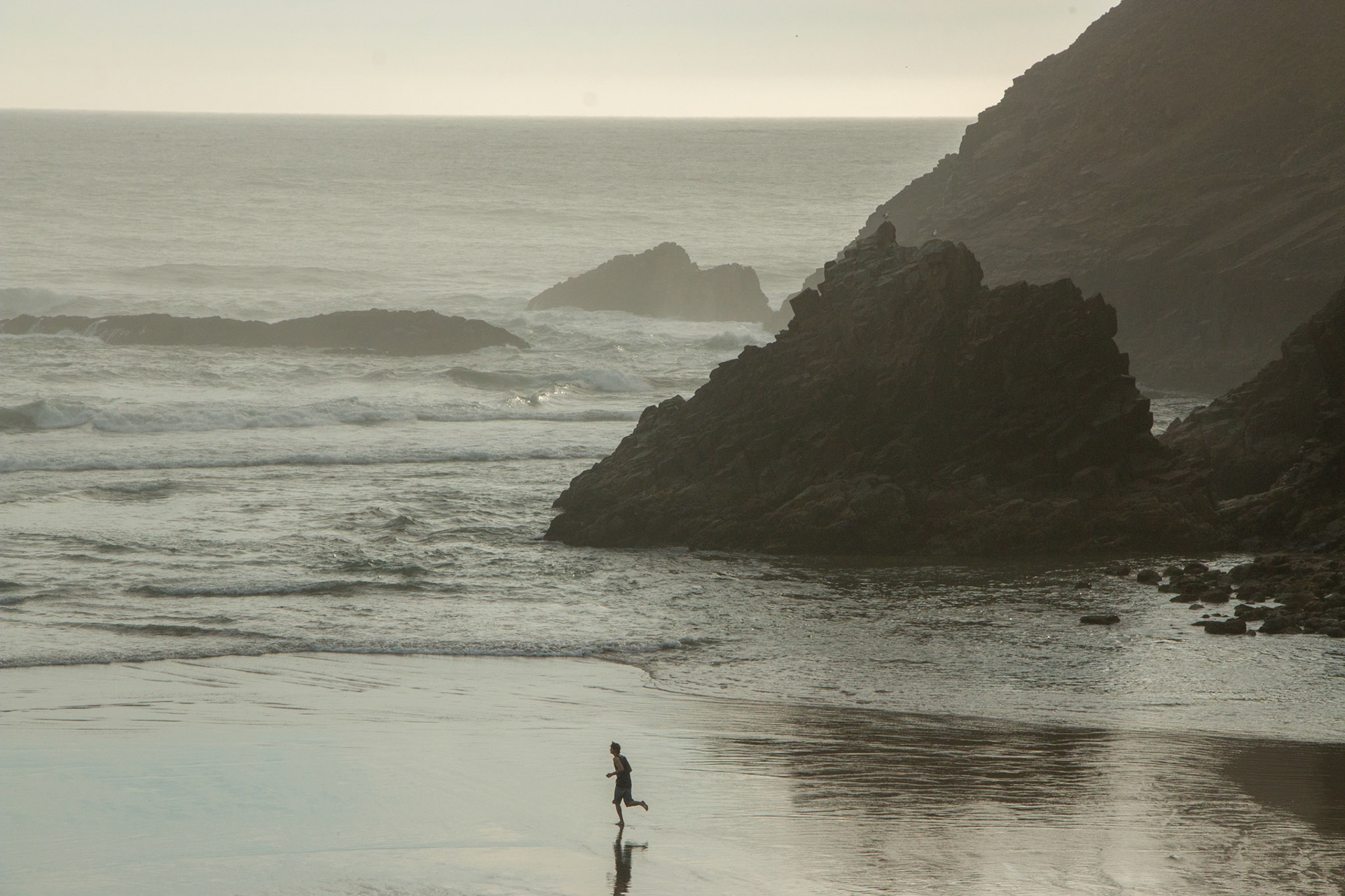 Running the waves on the Oregon coast.