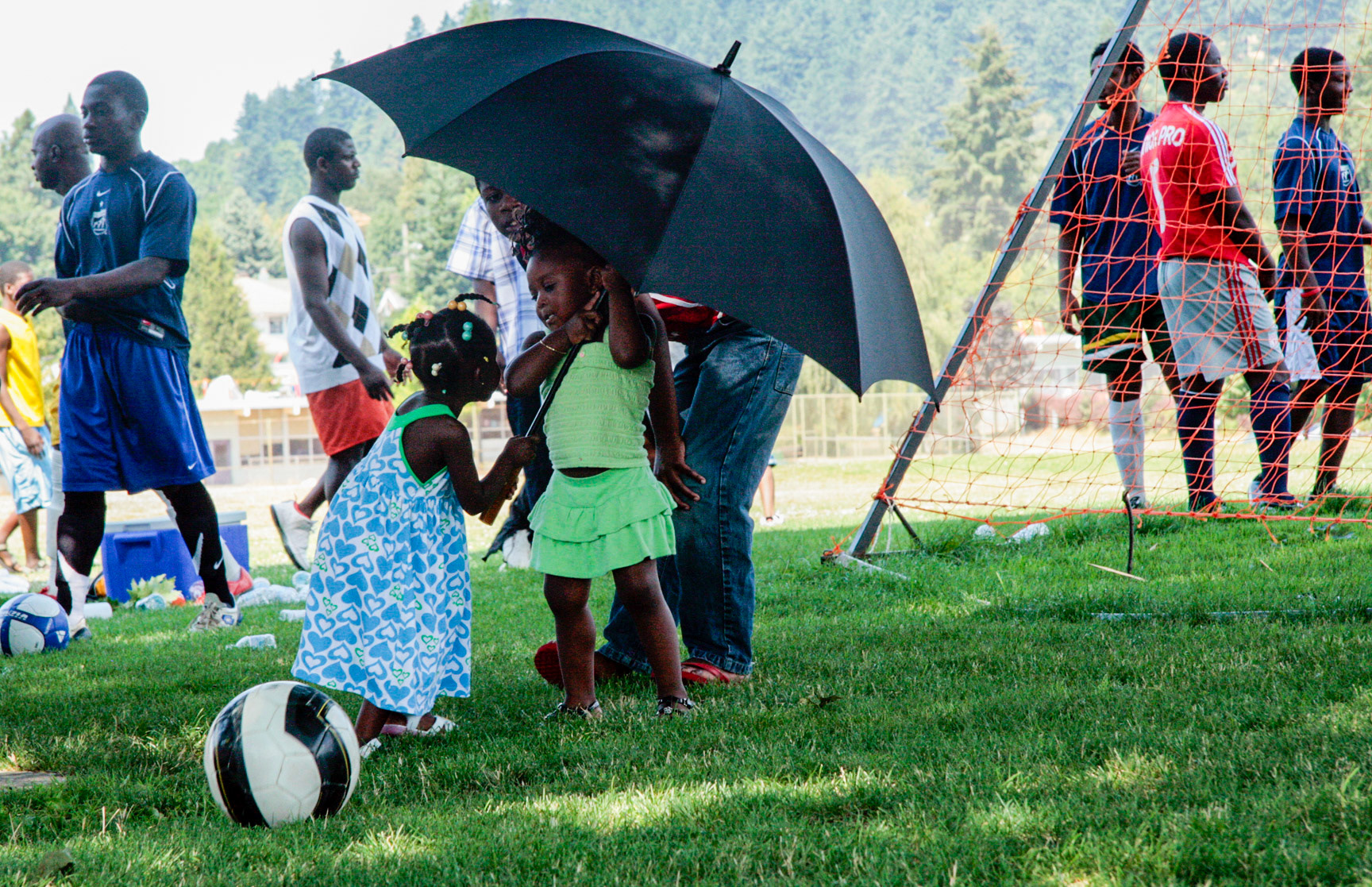 Under the umbrella at a Liberian Independence Day celebration.