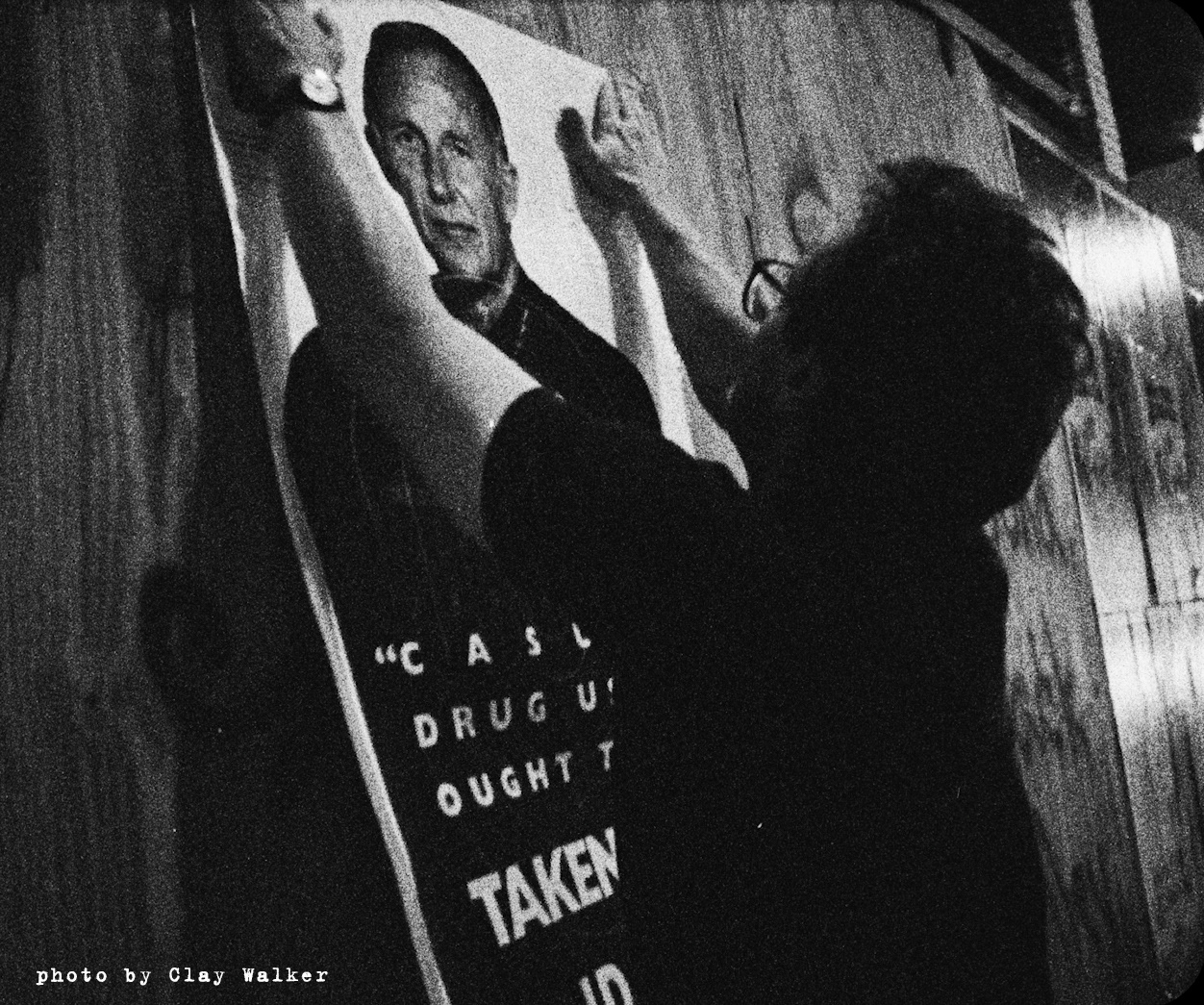 "guerilla" political poster artist Robbie Conal glues up image of LAPD Chief Daryl Gates in the PBS documentary "Post No Bills" • Los Angeles