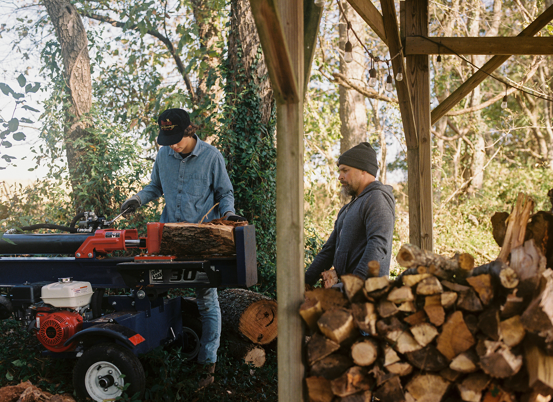 Dad and Silas splitting wood at our house in Millersville.