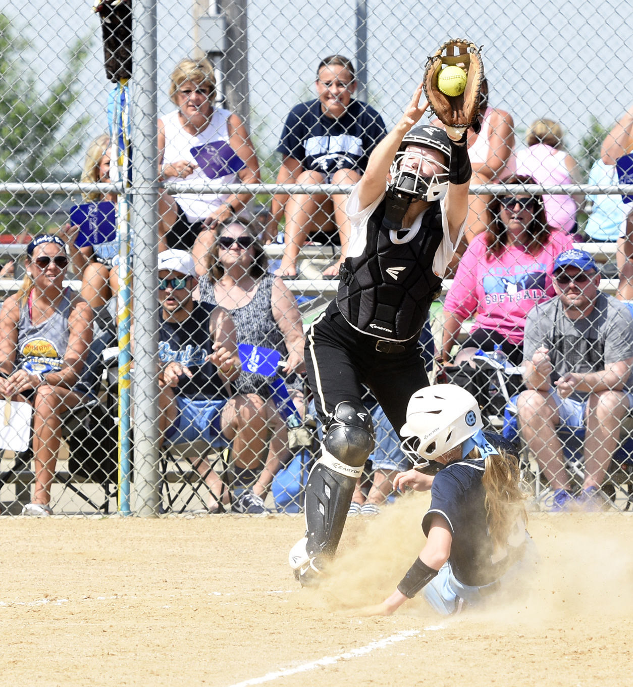 Central Hardin's Macey Martin scores as Clay County catcher Lauren Smith catches a throw during a quarterfinal game in the winners bracket of the Owensboro Health/KHSAA Softball State Tournament on Friday, June 8, 2018, at Jack C. Fisher Park in Owensboro. (Jill Pickett/The News-Enterprise)