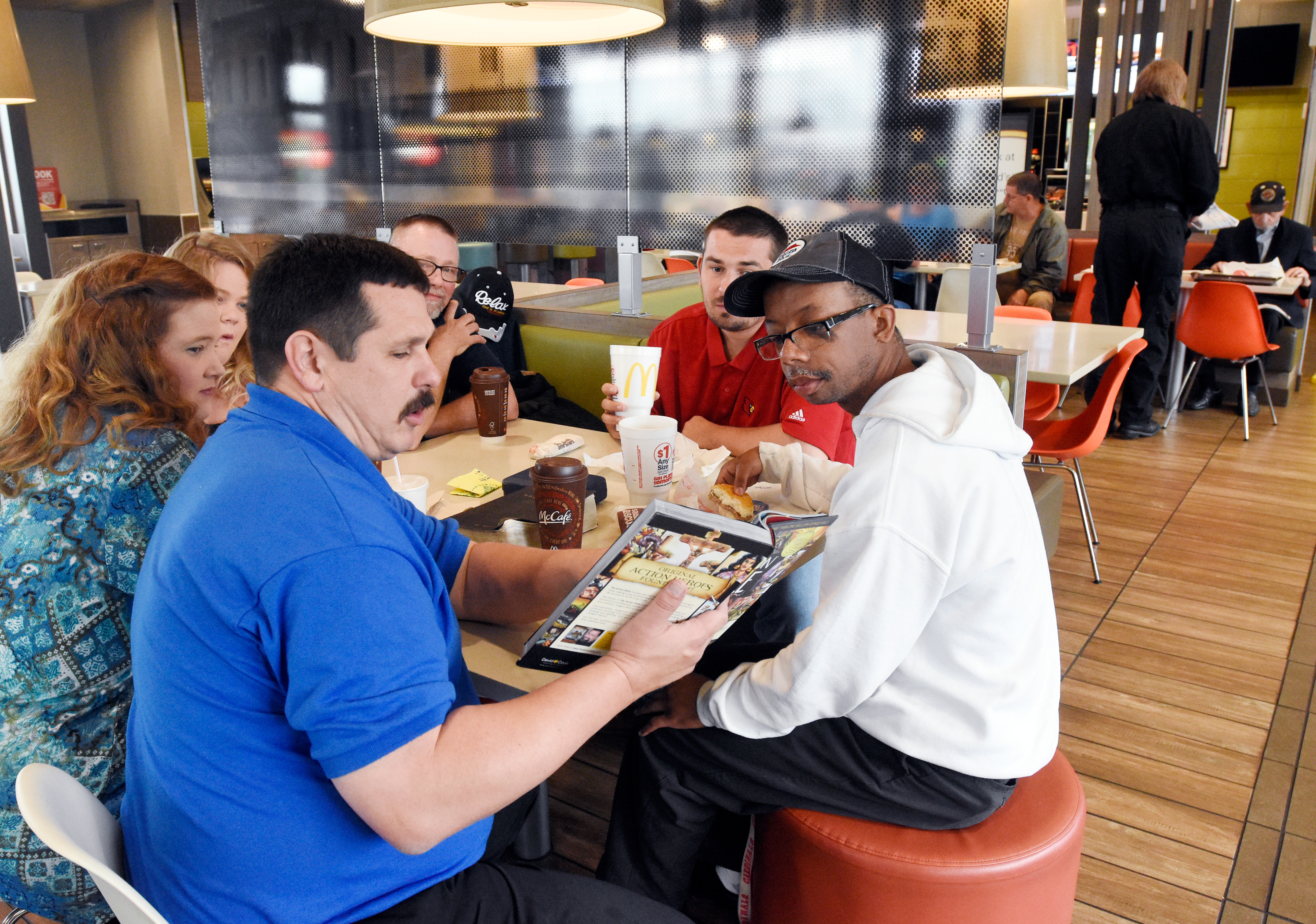 Darren Gillespie, pastor of Radcliff United Methodist Church, reads a Bible story during a church service Thursday, April 27, 2017, at McDonald's at the intersection of Dixie Boulevard and Lincoln Trail Boulevard in Radcliff, Kentucky. (Jill PIckett/The News-Enterprise)