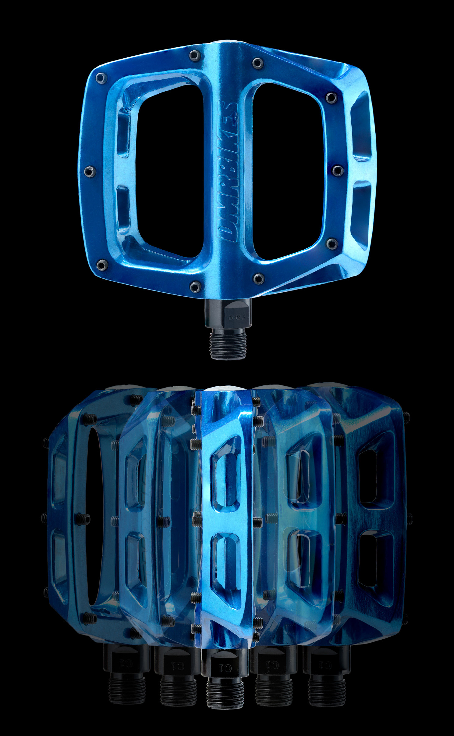 A blend of two blue bicycle pedals against a black background.