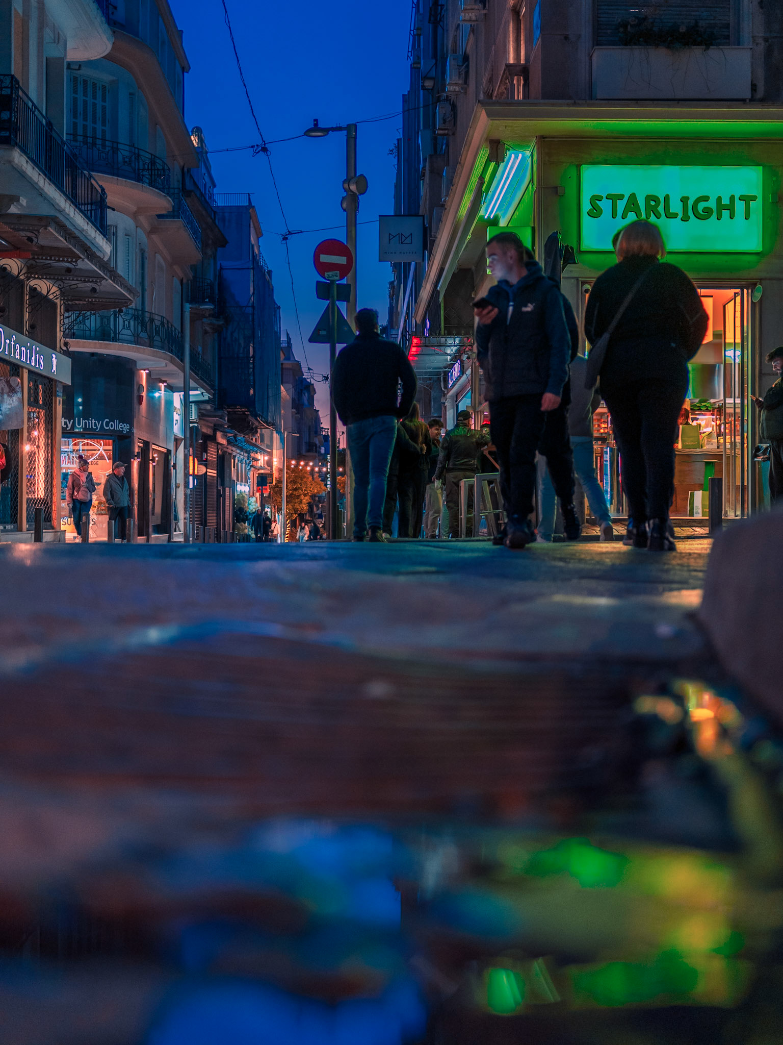 Where #Athens shines bright 💫I've always found these #lowangle captures to elevate people in my frames 📸In a city 🌃 with such an endless #nightlife, every street here has something new to offer!On my last nightwalk, I came upon those #reflections, outside @StarLight_Burgers 🍔, and without much though, and having the #neonlights  painting the puddle, I waited for a sec to frame a few people passing by, to create this shot 🤘I really hope you've enjoyed it 👇