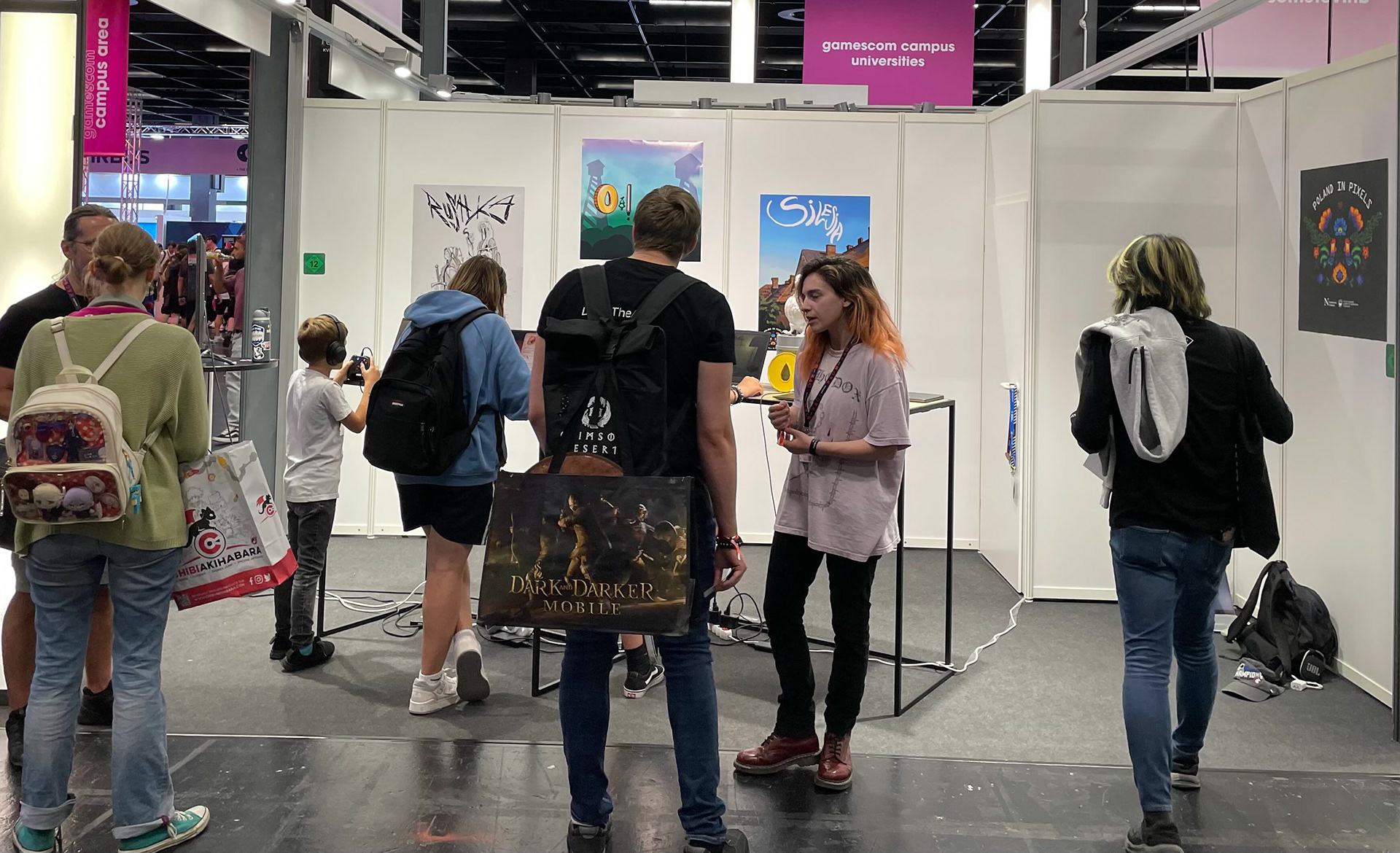 Northeastern's booth at Gamescom, with all four of program's games available to play.