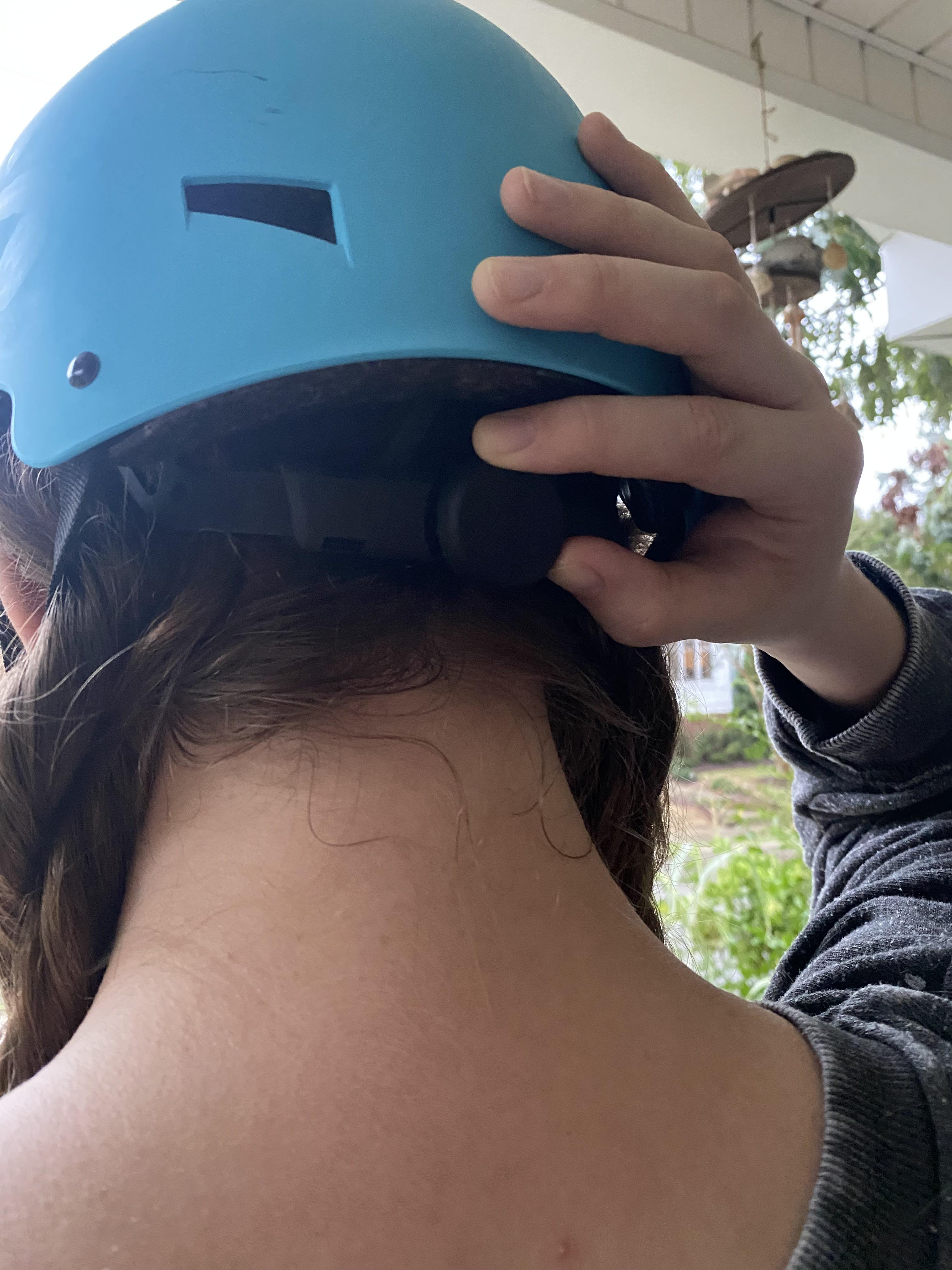 User tightening the occipital stabilizer