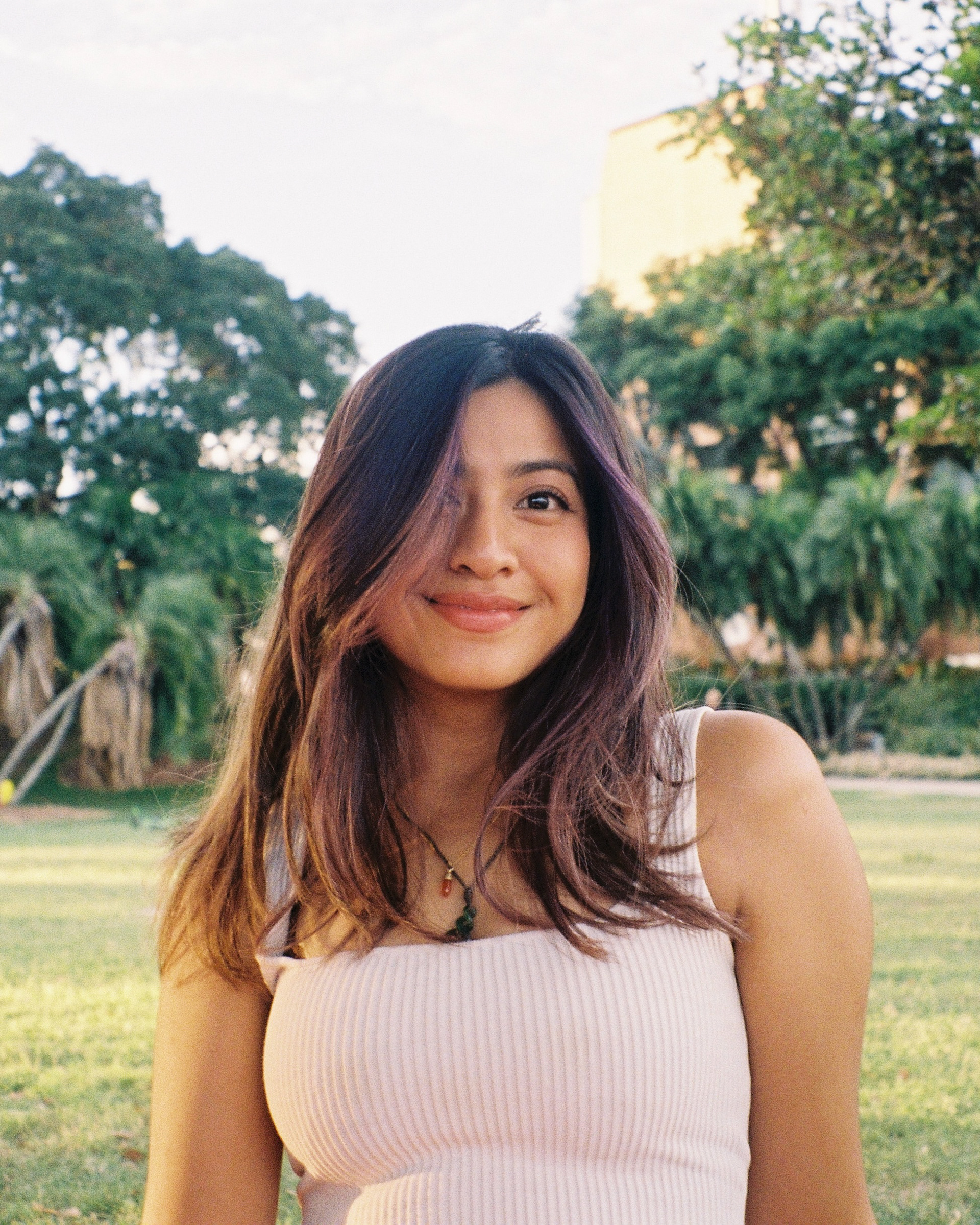 live music photographer sitting in a park in Brisbane during golden hour