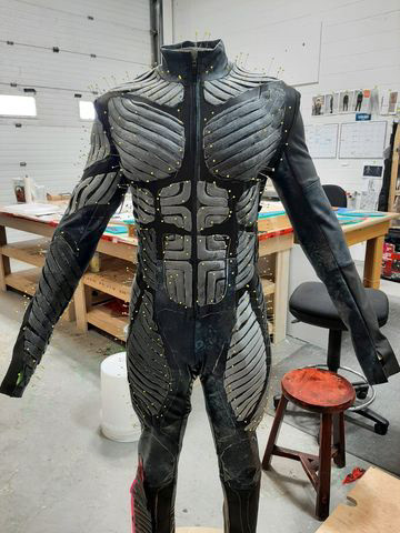 The muscle strands been sculpted, molded, and casted. Then applied to the suit by each group getting ready for glueing