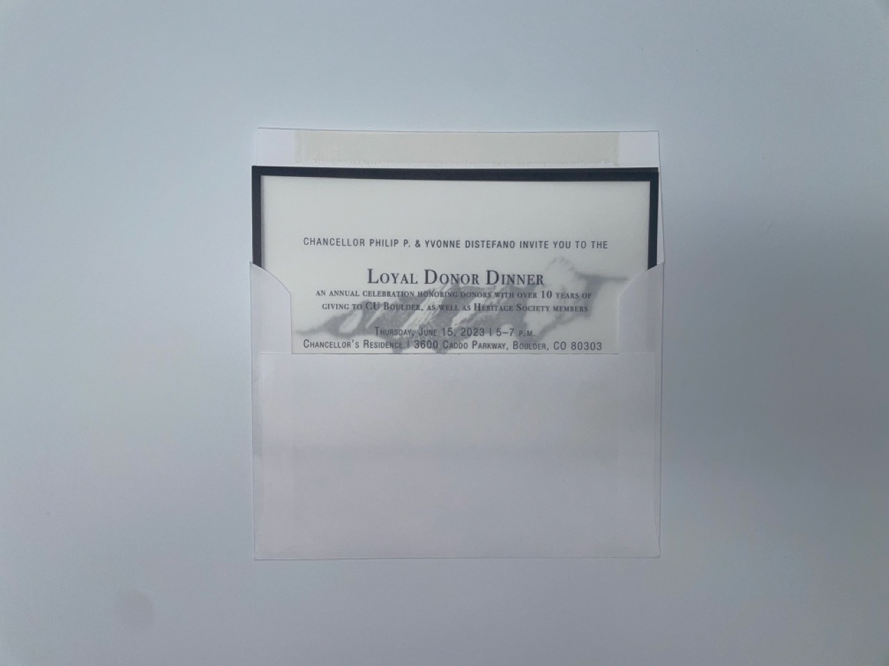 Invitation with art card shown as the stuffed by the printer