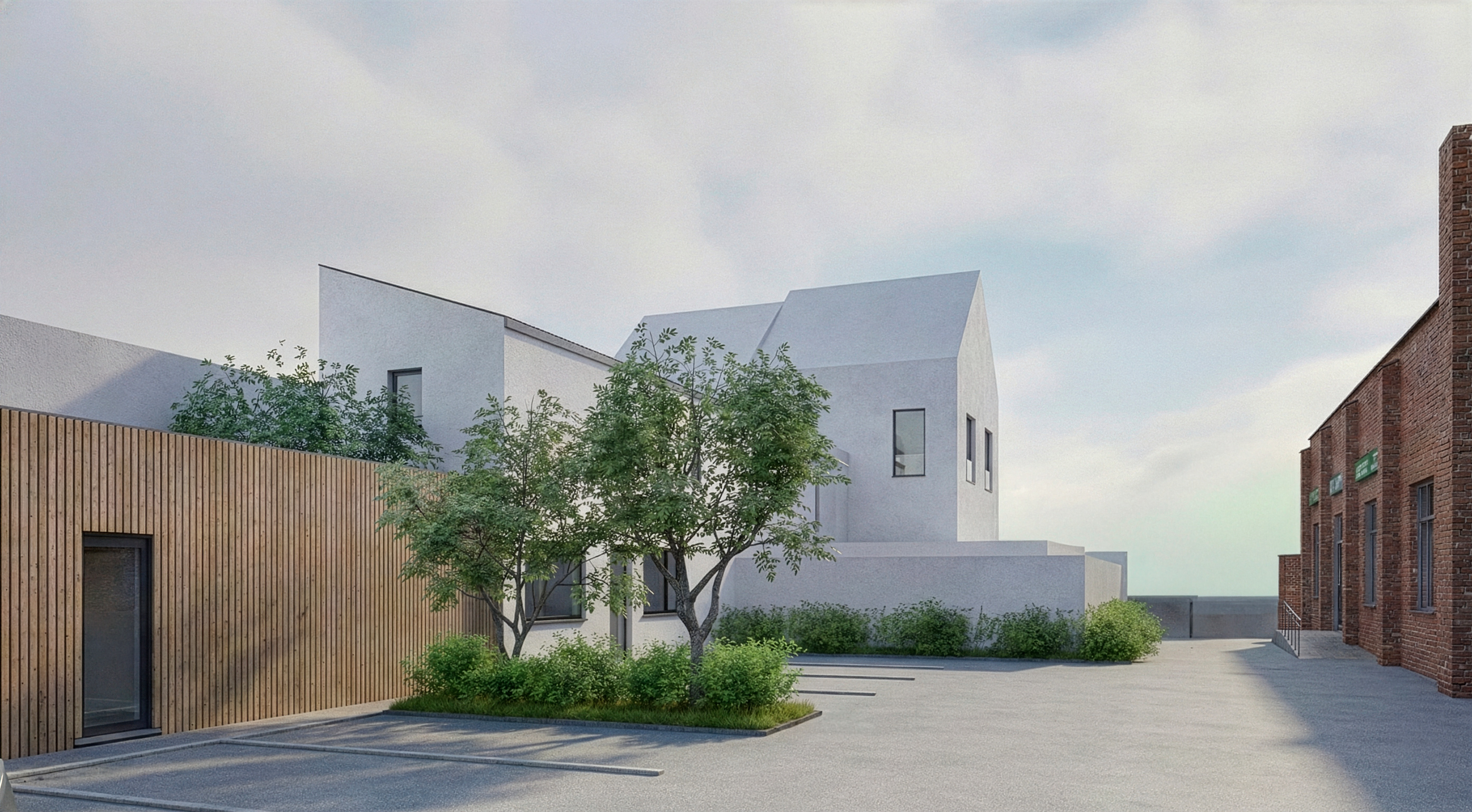 Abords aménagés avec stationnements, végétation et accès aux bâtiments