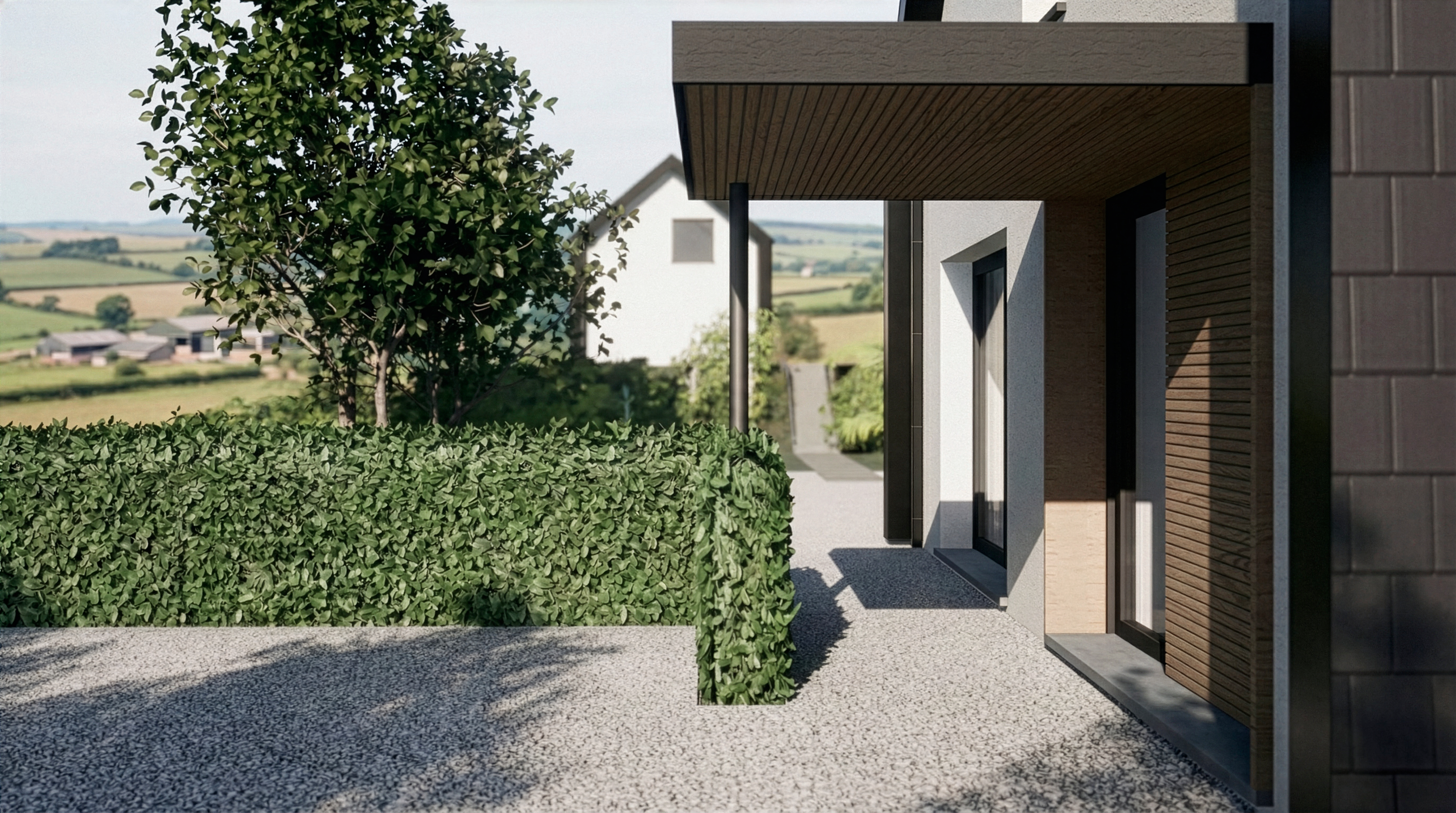 Détail de l’entrée avec auvent, bardage bois, façades en tuiles anthracite et cheminement extérieur gravillonné.