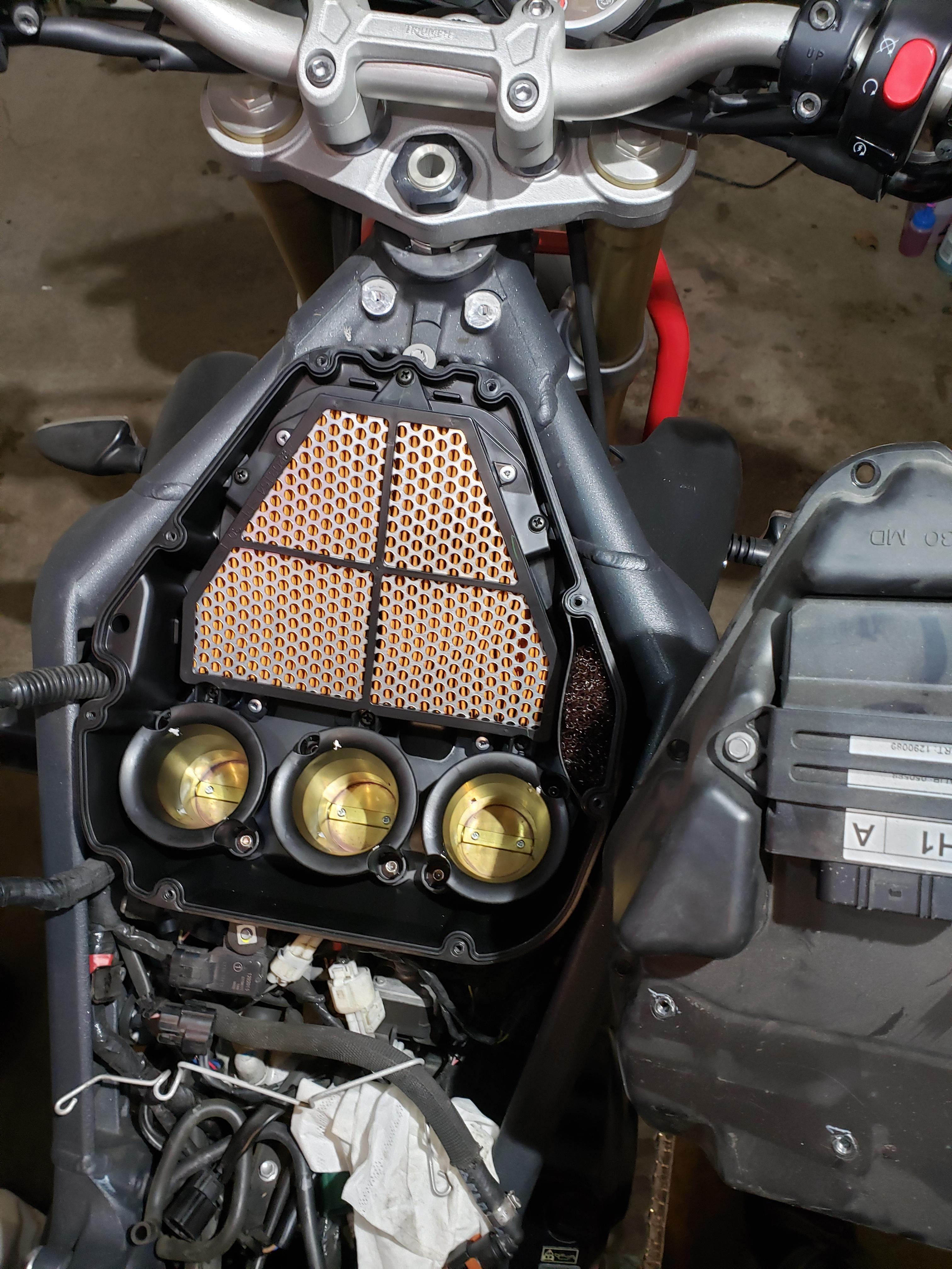 Air filter and intake trumpets exposed.