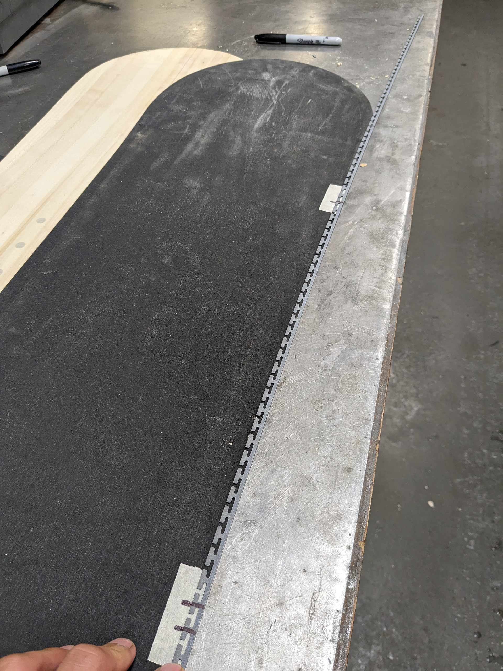 Prepping to bend edge to fit.