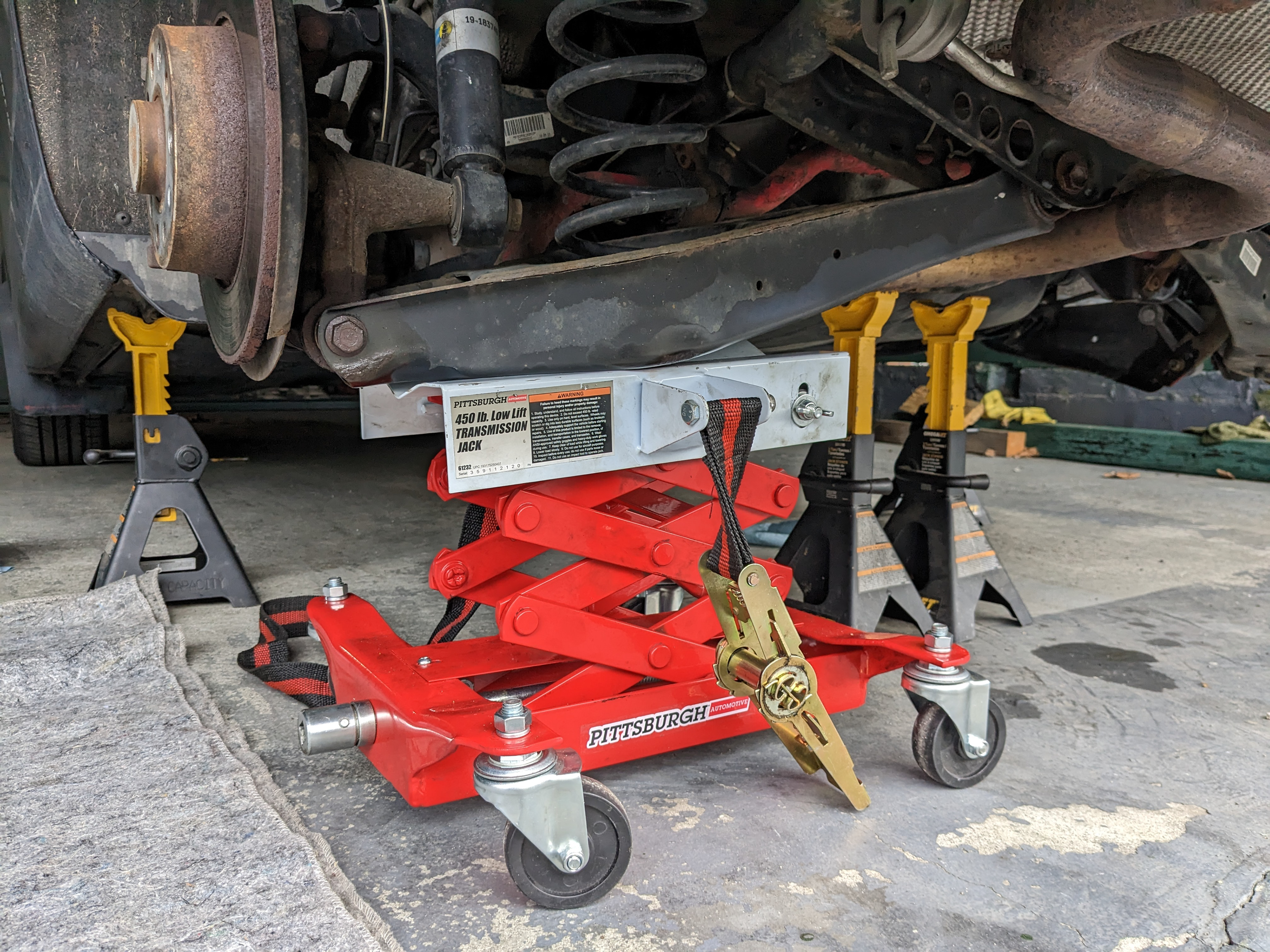 Dropping rear lower control arm.