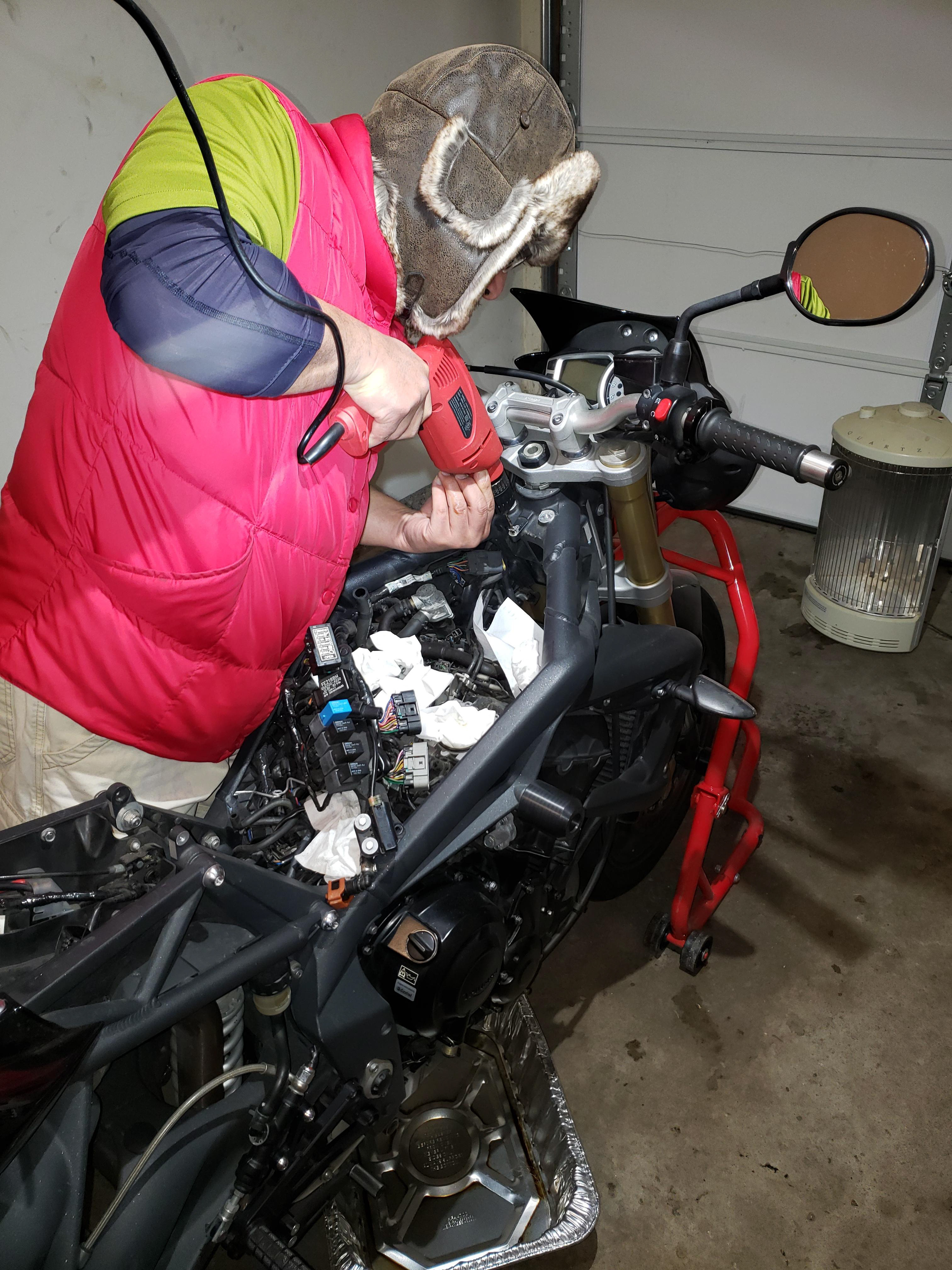 Drilling out the overtorqued bolt.